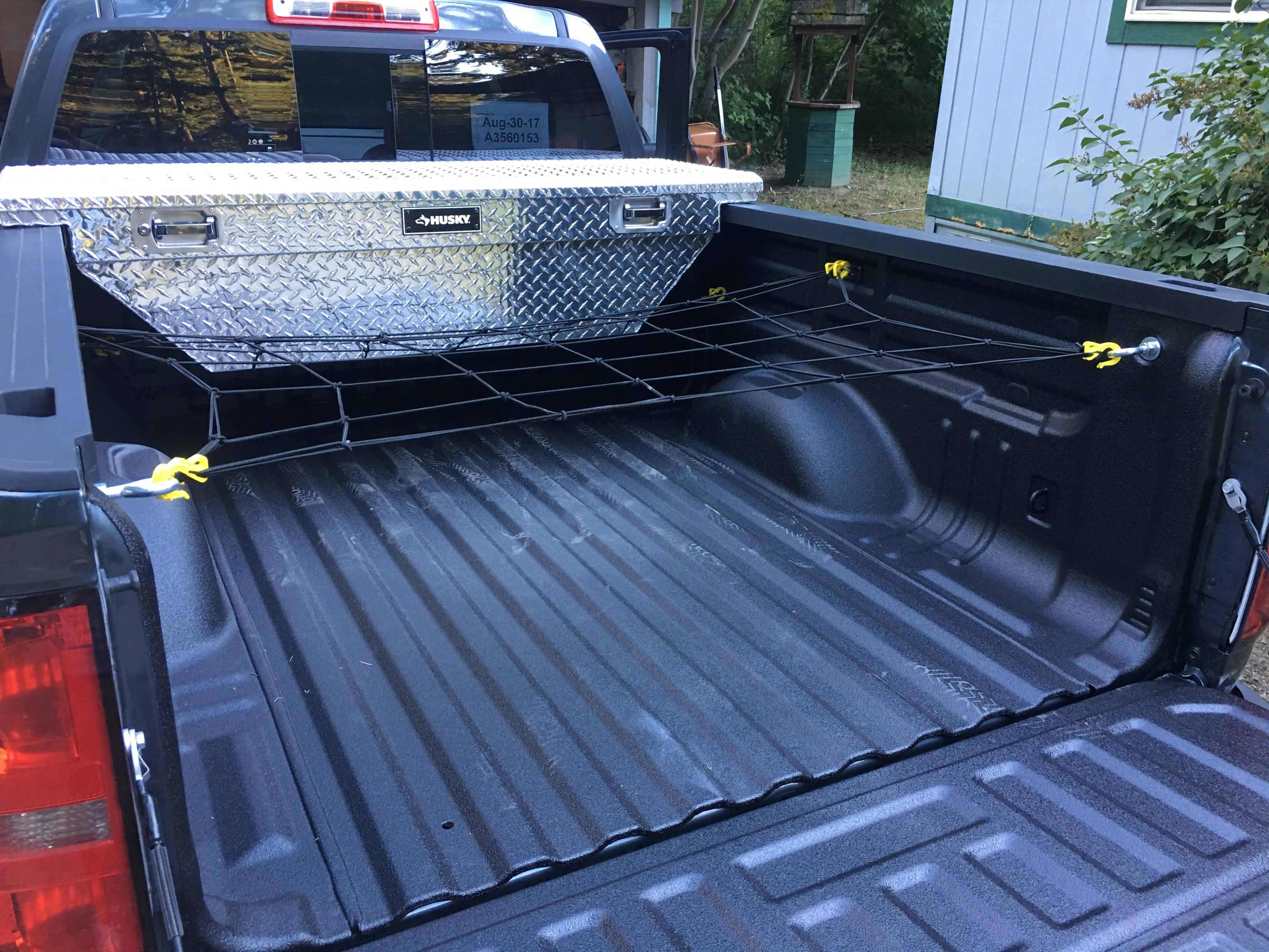 Bedliner, tool box, cargo net, and bed drings. Cargo is now managed