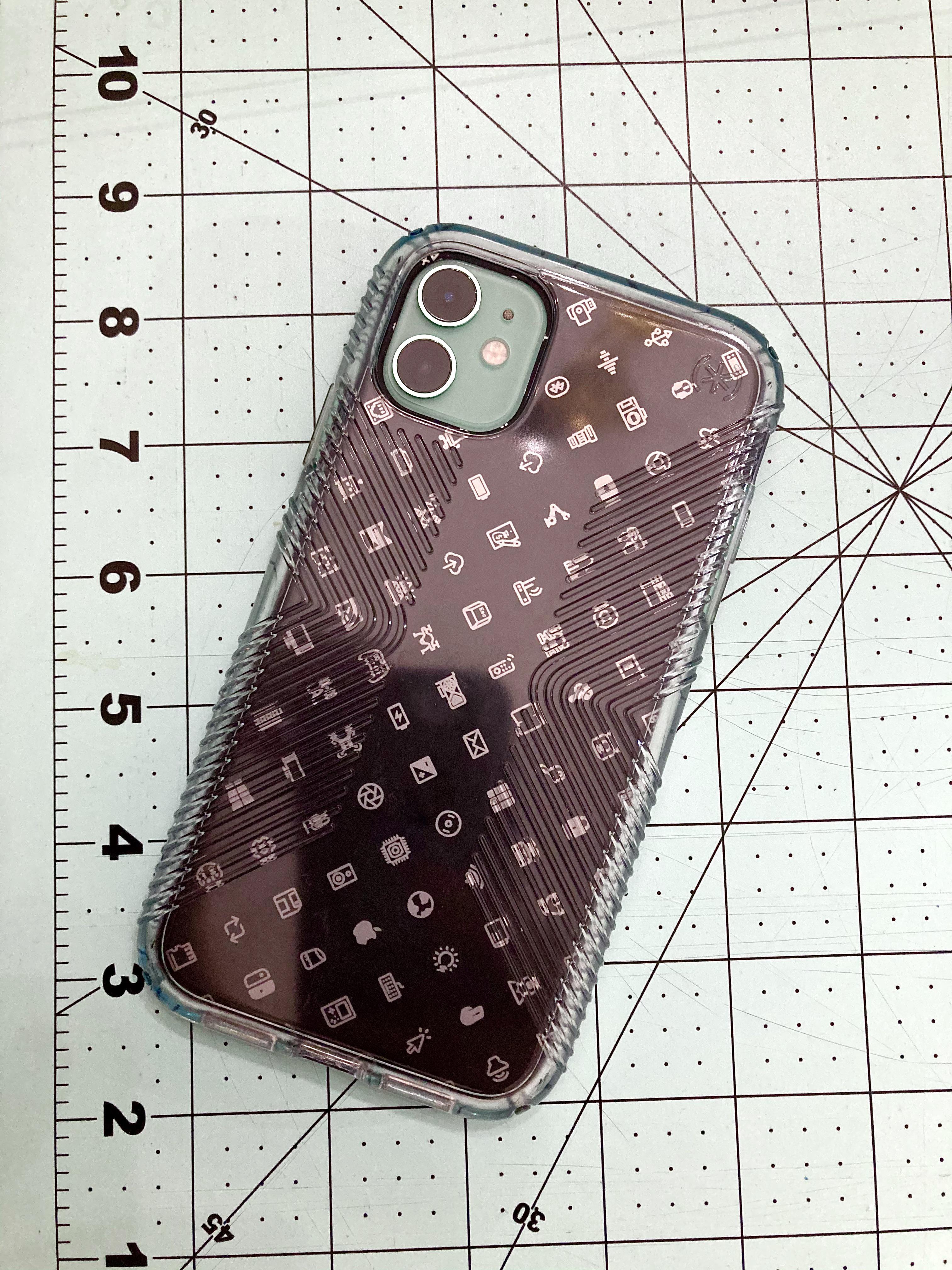 My mint green iPhone 11 with a Dbrand silicone “Icon” skin and a Speck