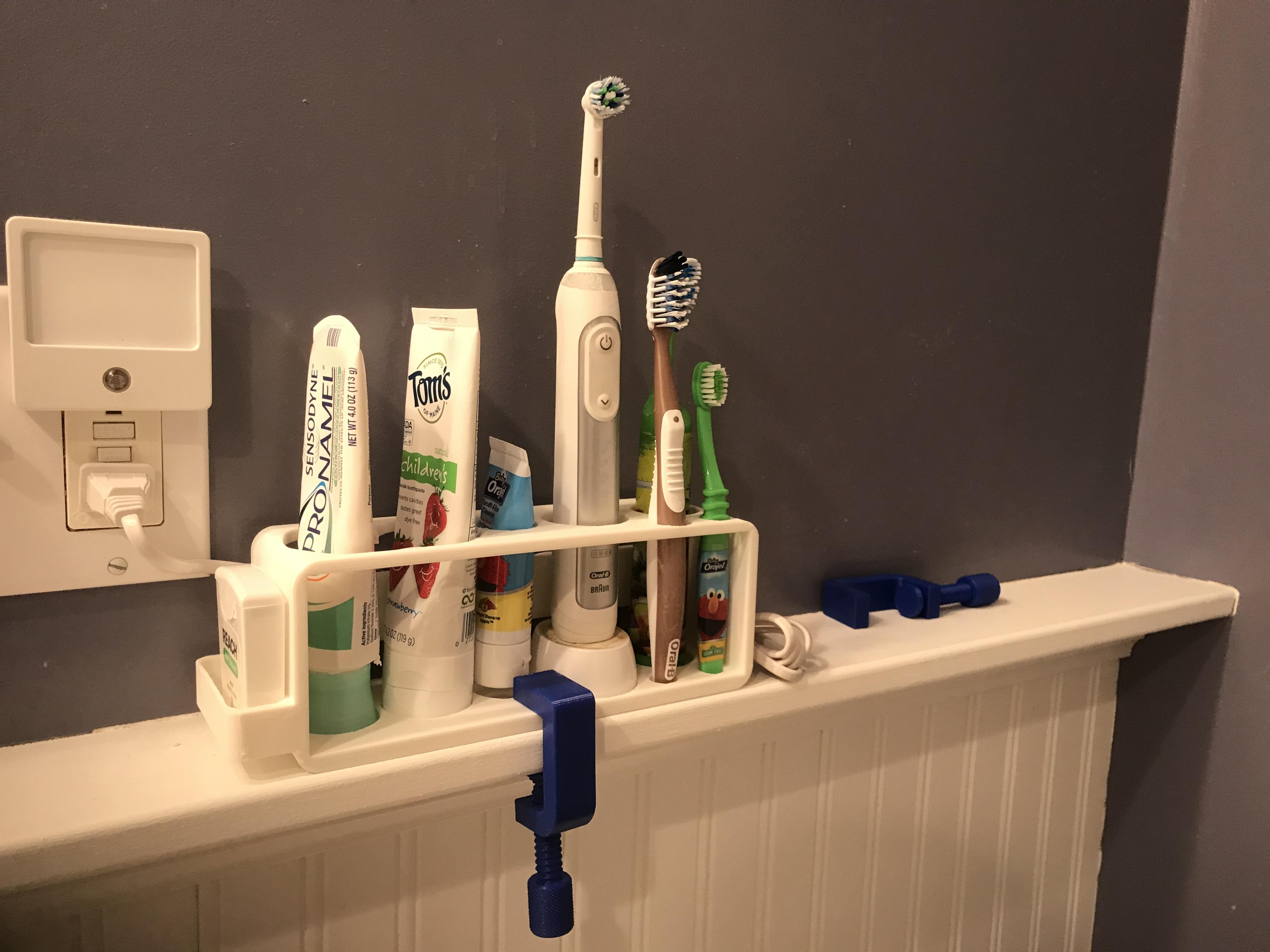 Custom toothbrush holder for all ages. A printed clamp holds it in