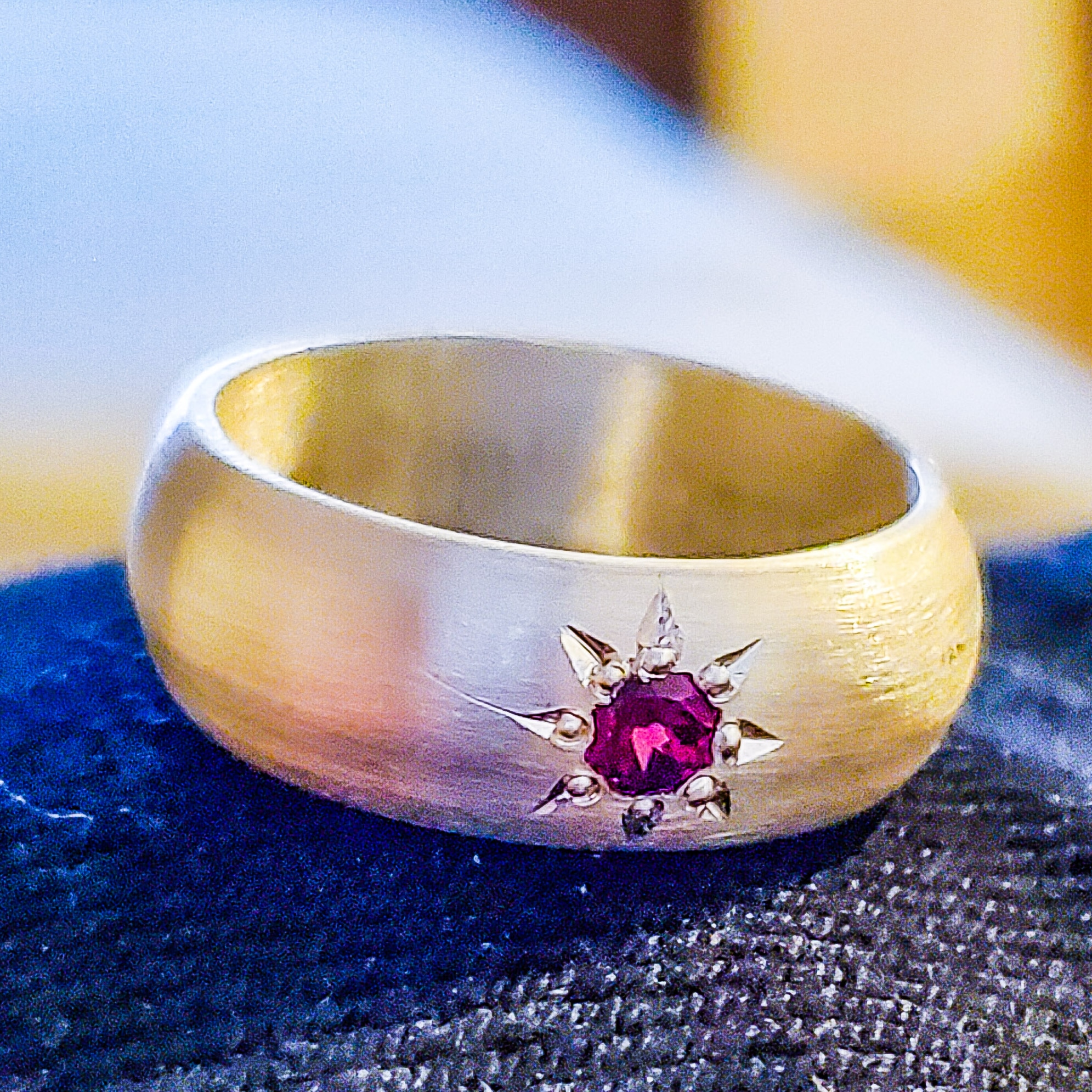 I made a satin finish silver band with an 8 point star setting. Each