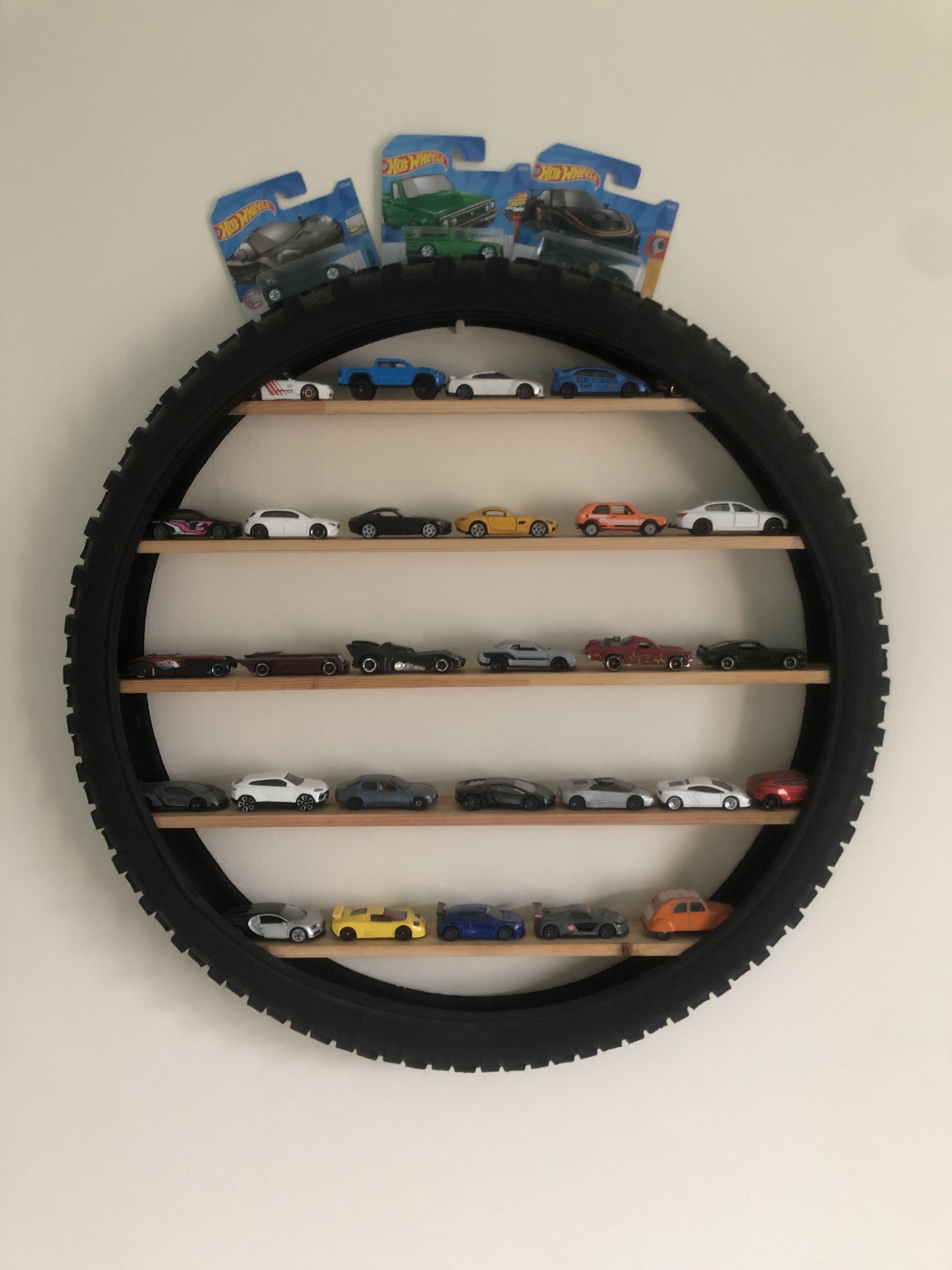 A shelf I made with my dad out of a punctured bike tire r/HotWheels