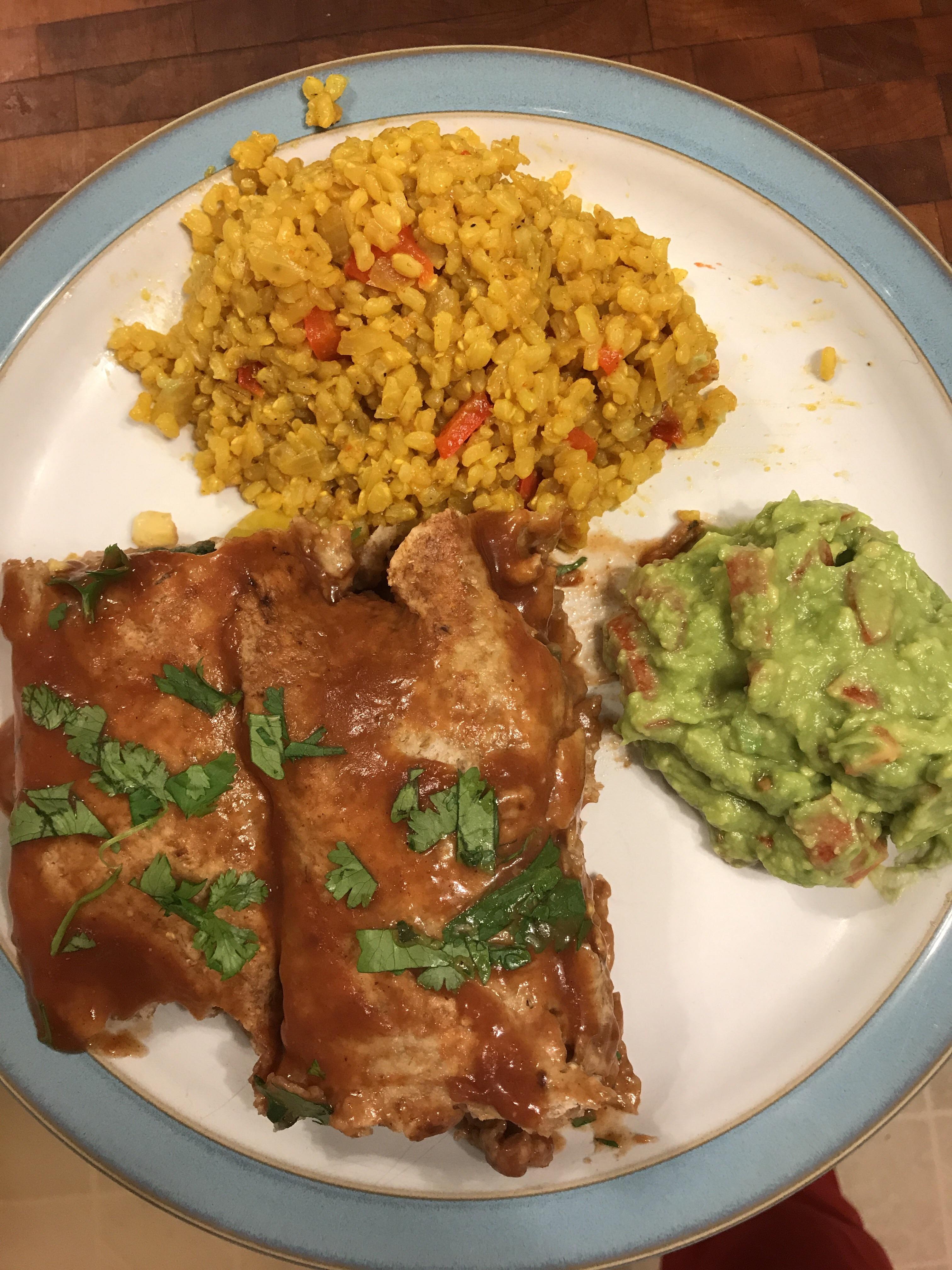 Potato and refried bean enchiladas. Yellow rice and guacamole. No oil