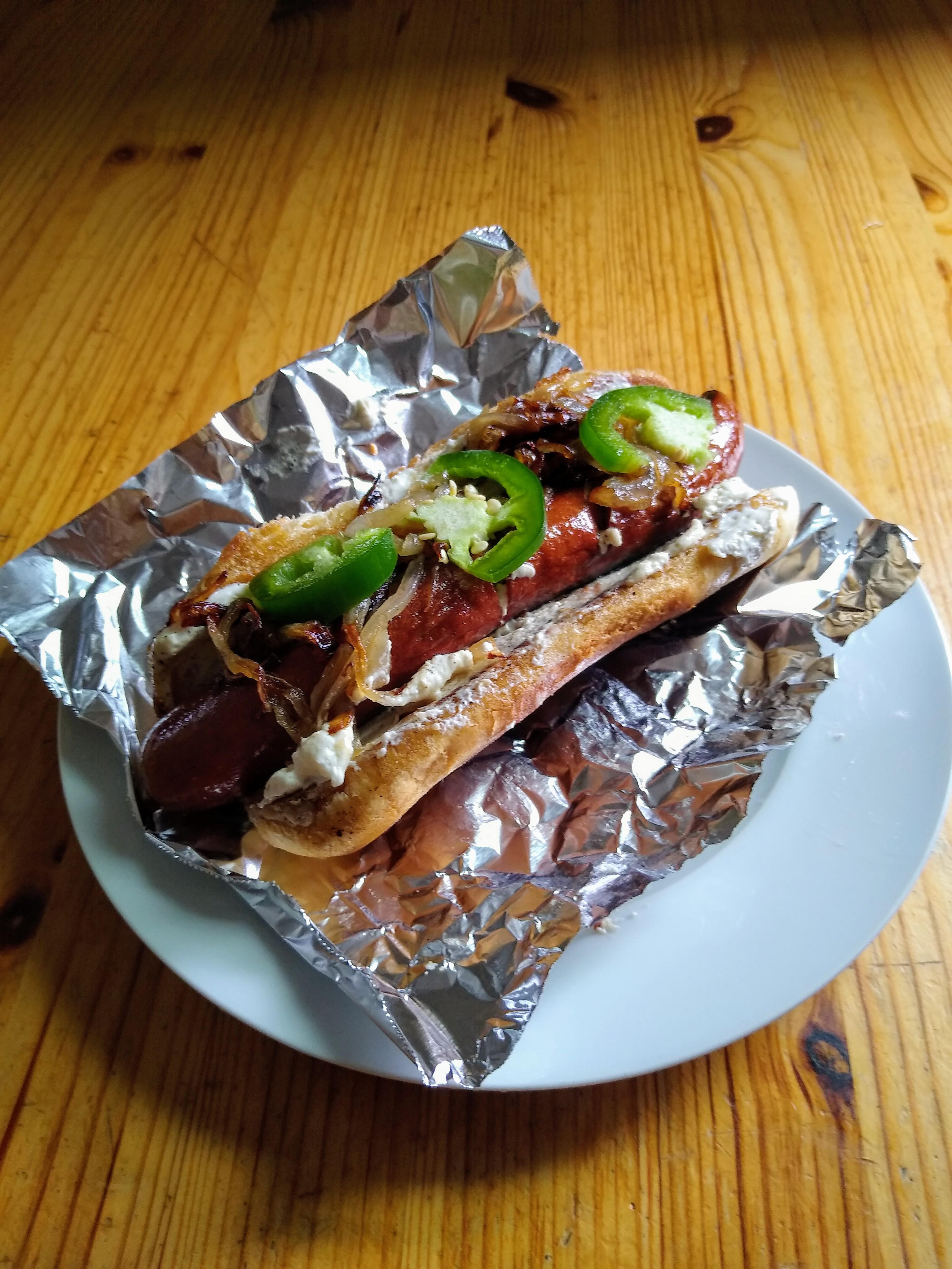 Homemade Seattle Hot Dog with cream cheese, onion, jalapeno, and spicy