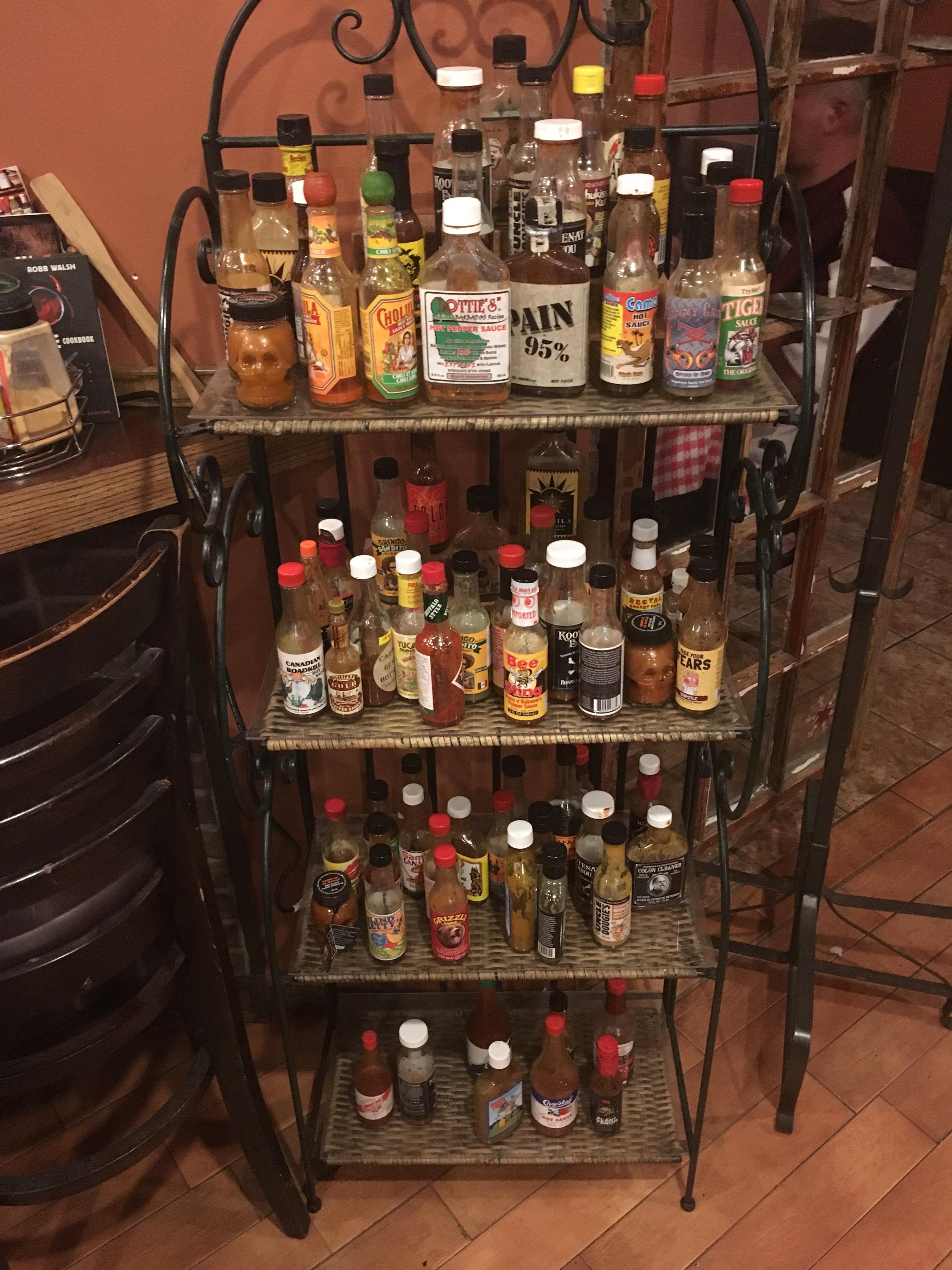 Hot sauce shelf at this restaurant r/hotsauce