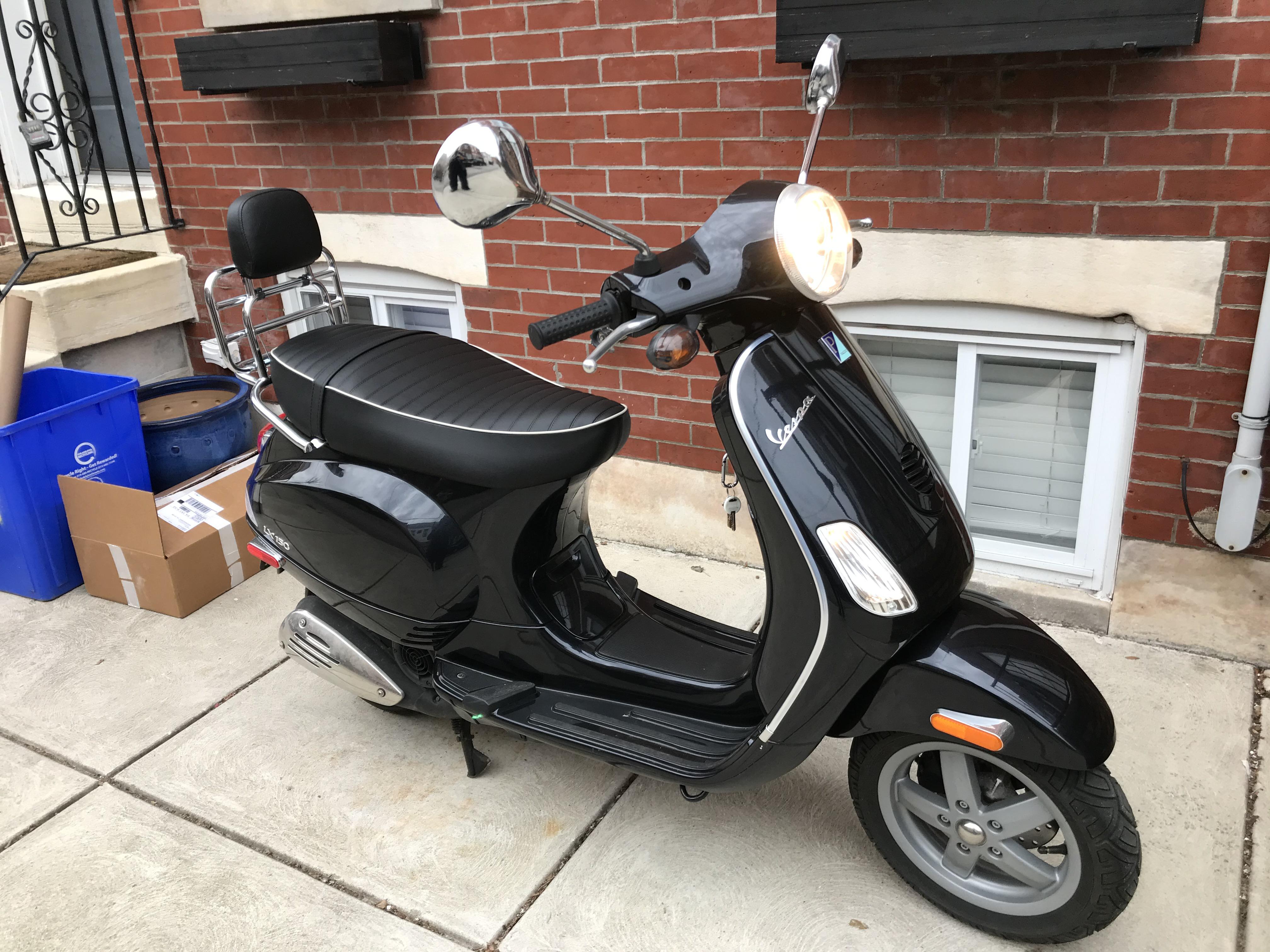 New seat and sissy bar got my LX150 looking fly as hell. Thinking about