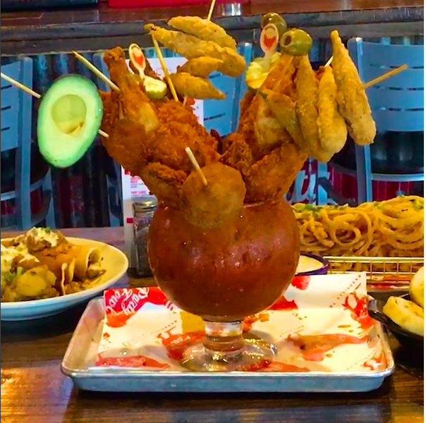 Two whole deepfried chickens, chicken tenders, potato croquettes, half