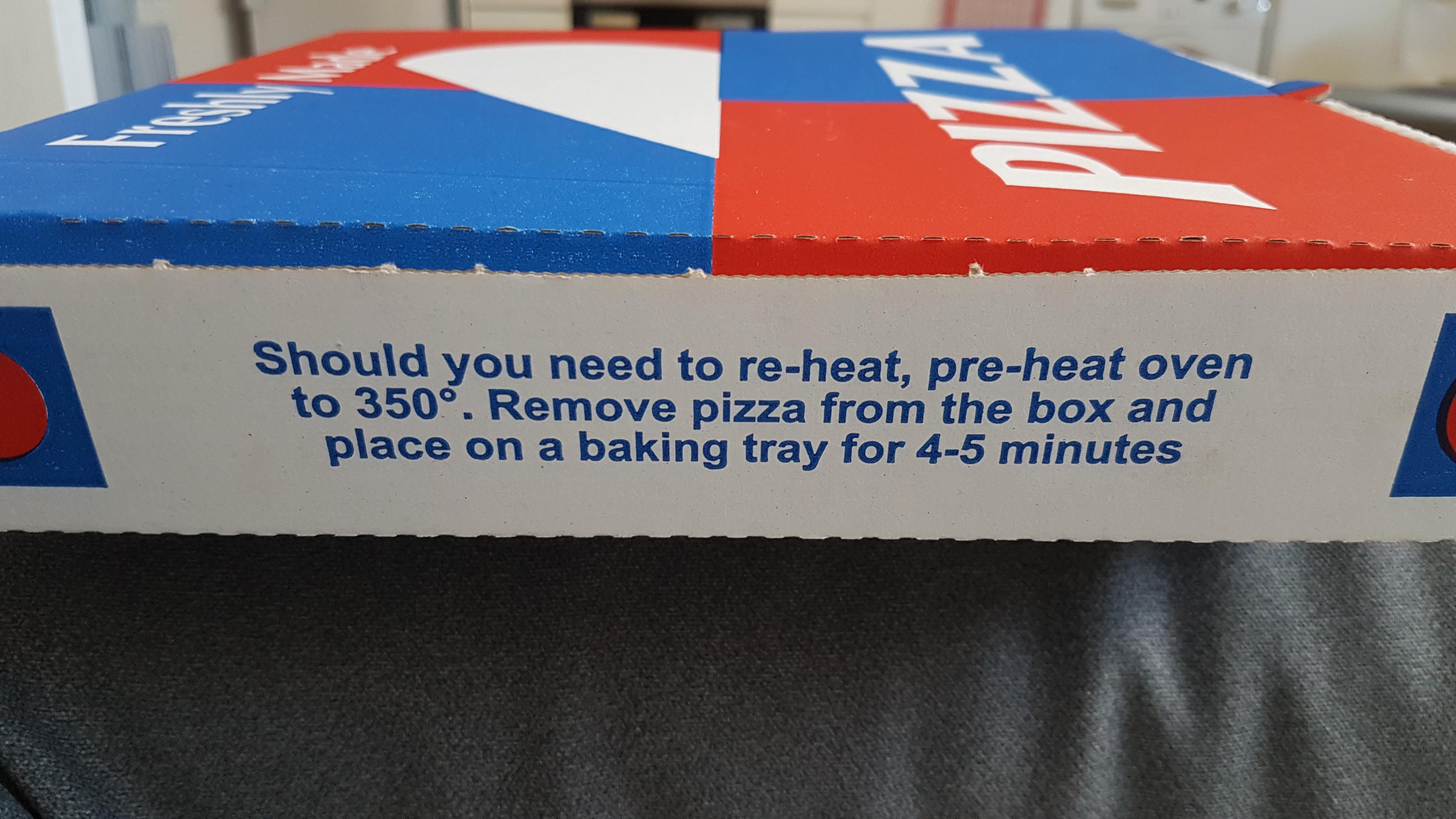 This pizza box has instructions for reheating the pizza r