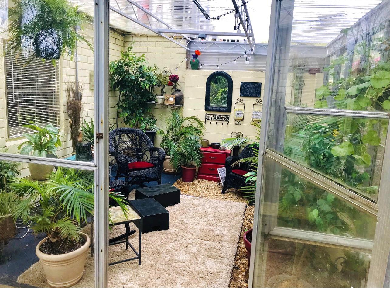Wanted to show off my moms greenhouse and reading nook r/CozyPlaces