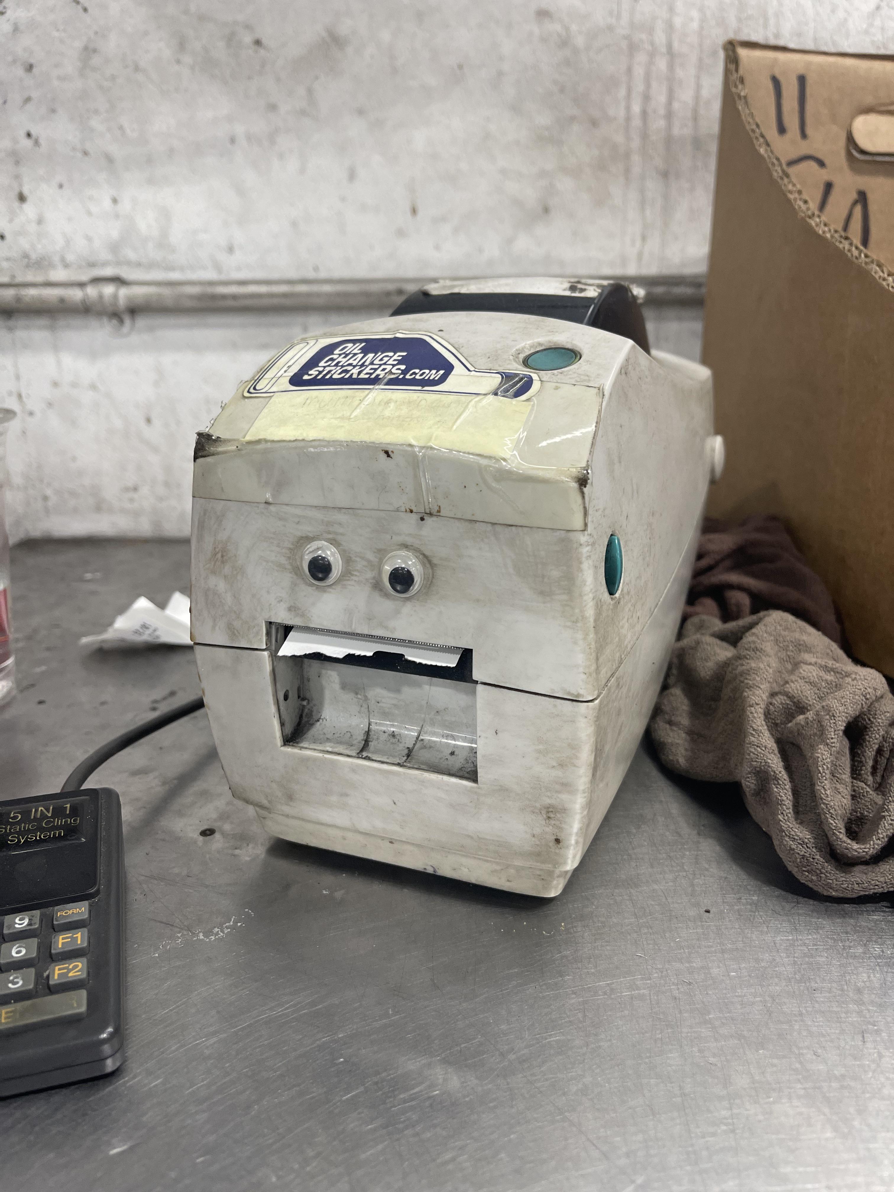 Our oil change sticker machine.