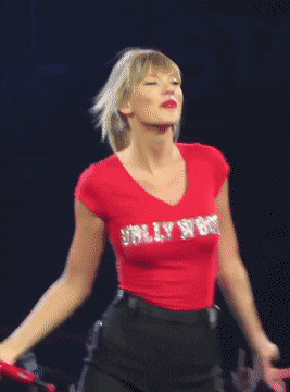 Super sexy in red Taylor Swift dancing, shaking her fabulous boobs in