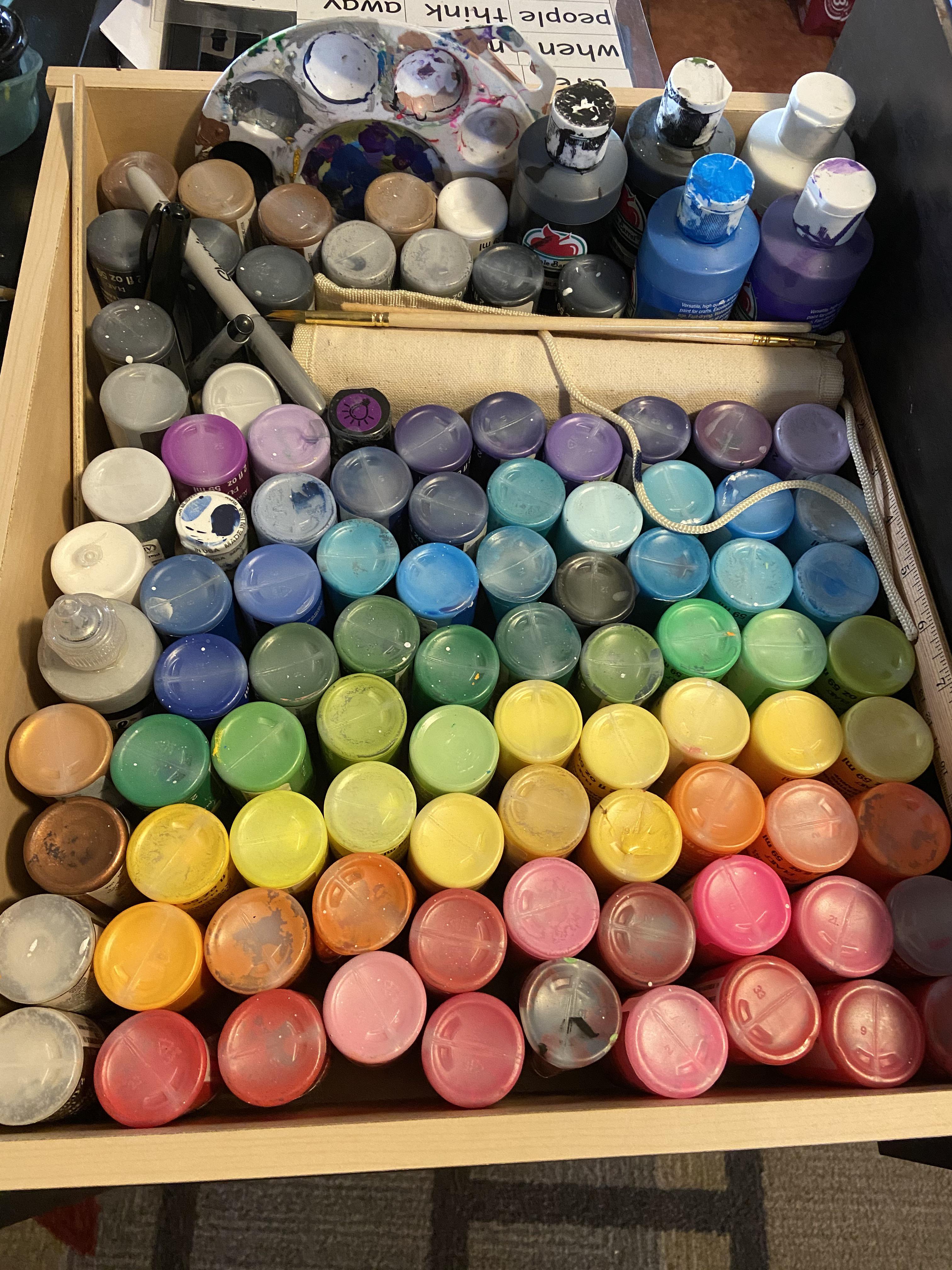 My paints are stored upside down so I can see the colors easily r