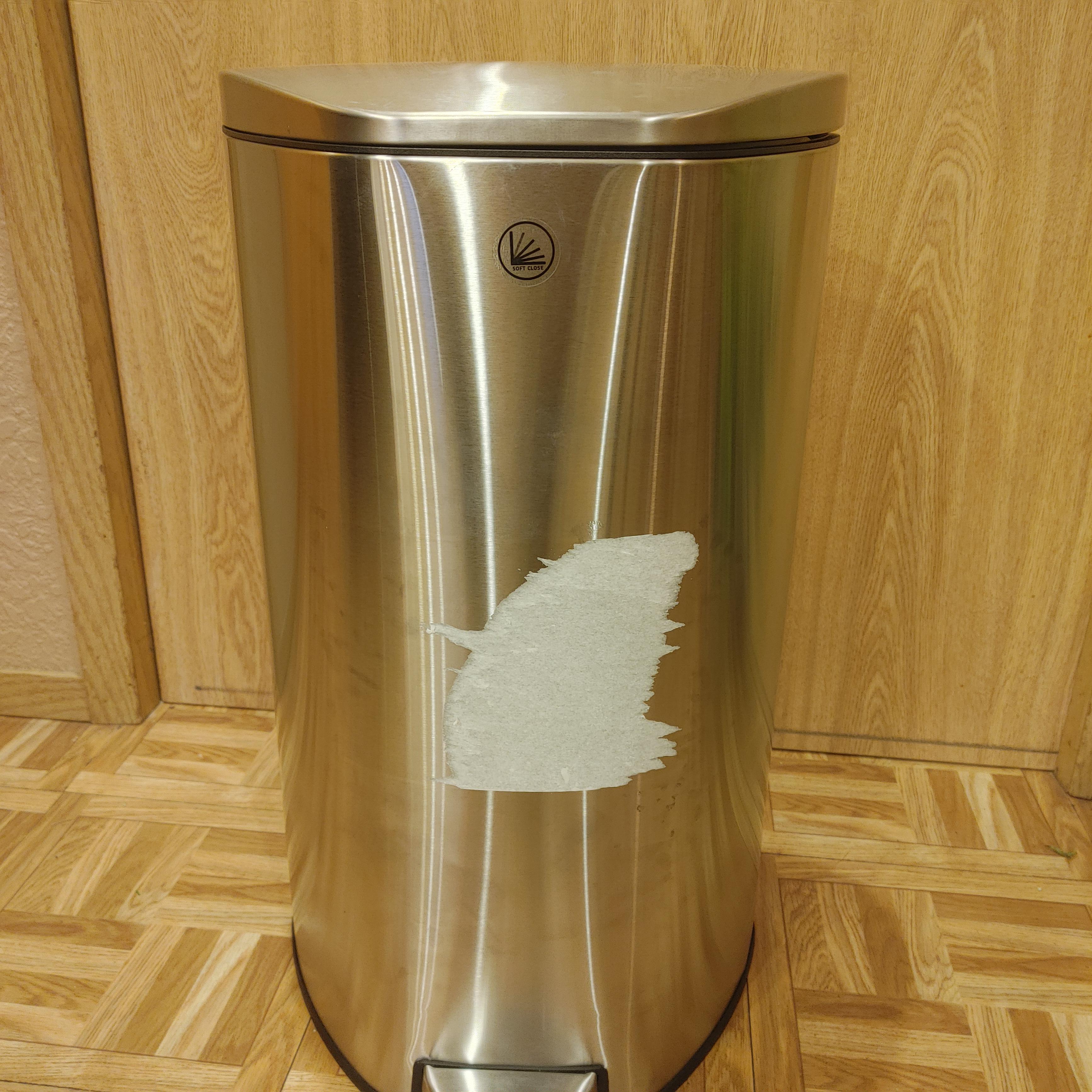 Bought a new trash can with a huge label on the front. Now it looks