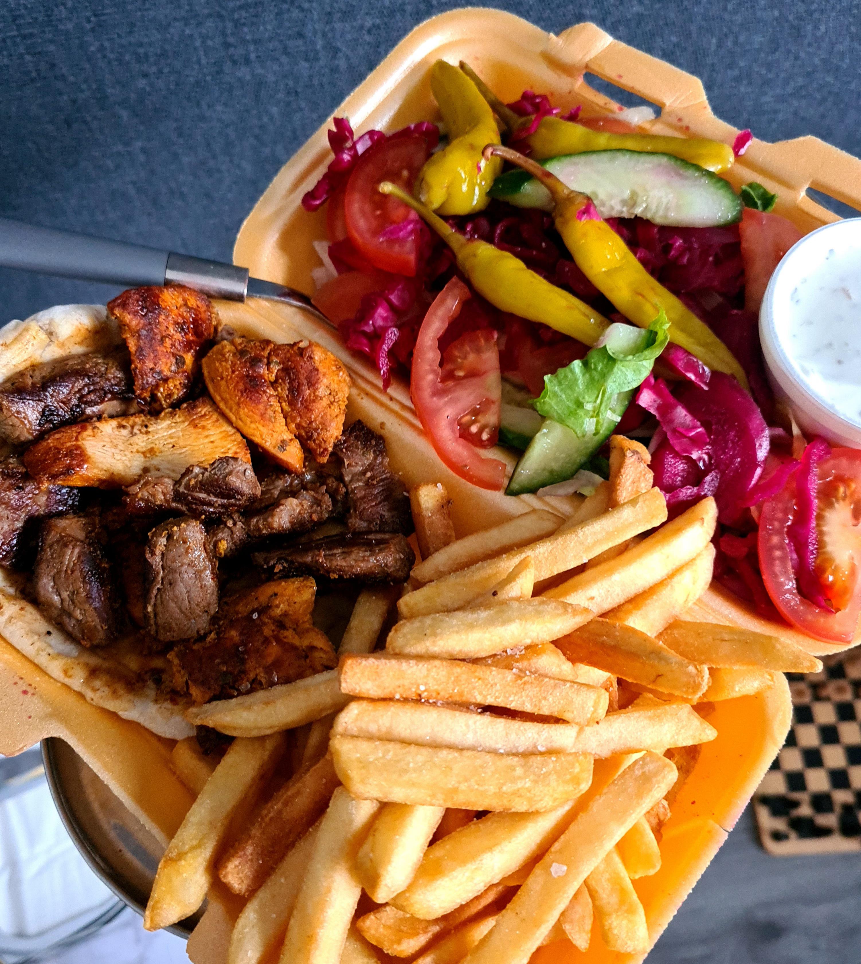 Last night's mixed kebab beef, lamb, chicken, with chips, salad and garlic sauce. 😋 r/UK_Food