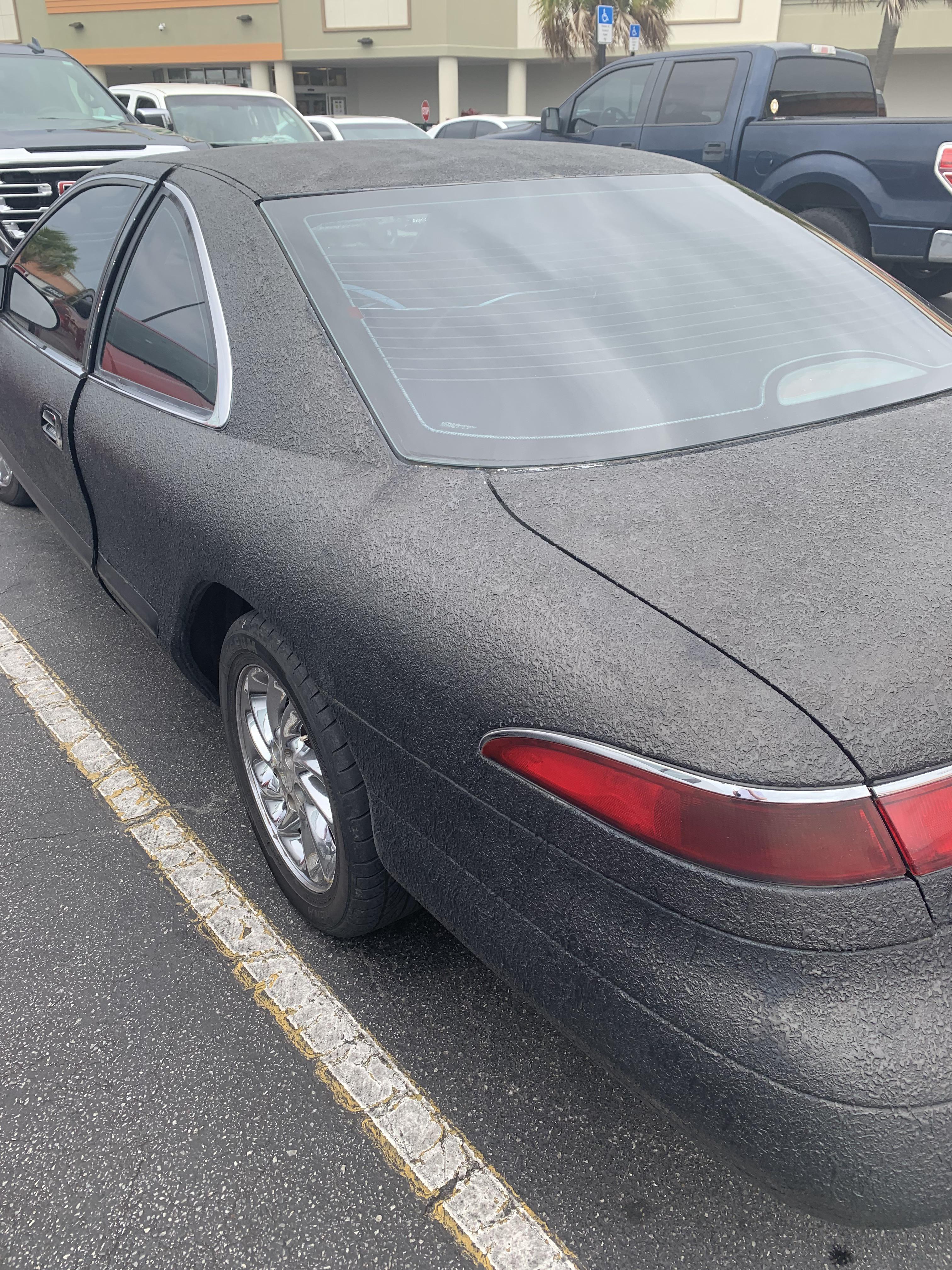 This entire car is sprayed with truck bed liner. So thick the door can