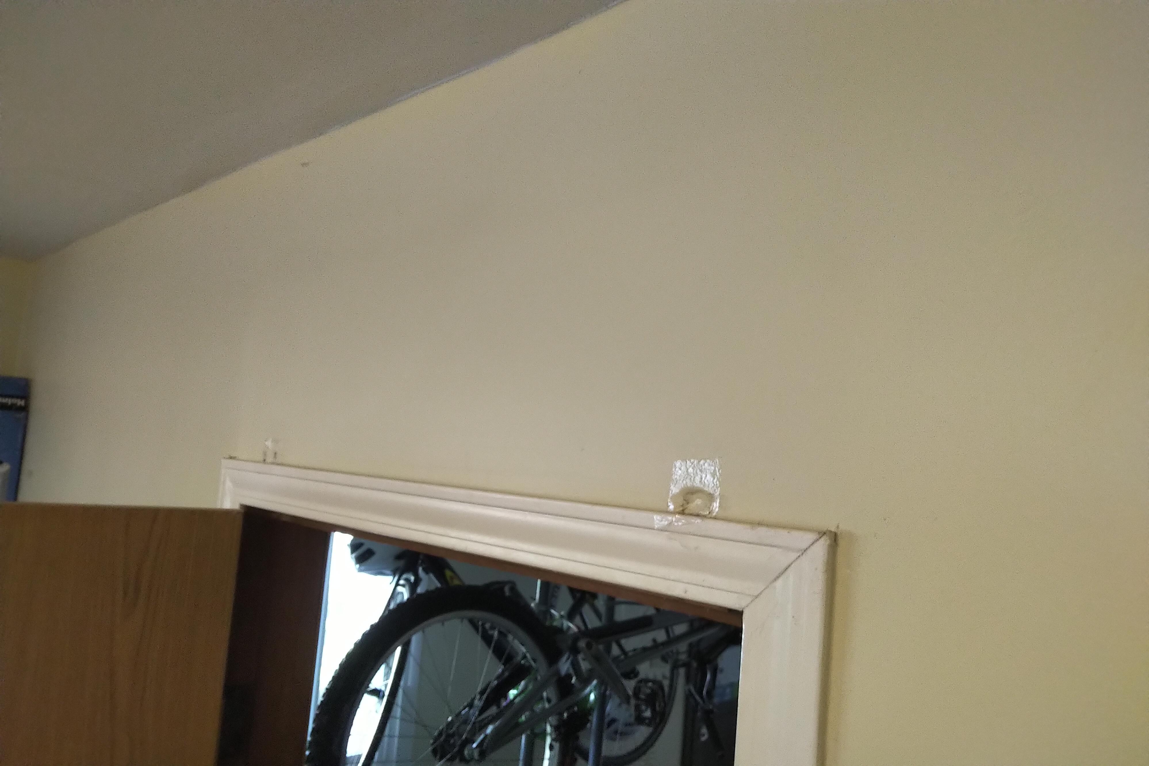 Doorway pull up bar is caving my wall in. Any idea on how to strengthen and fix it? r/fixit