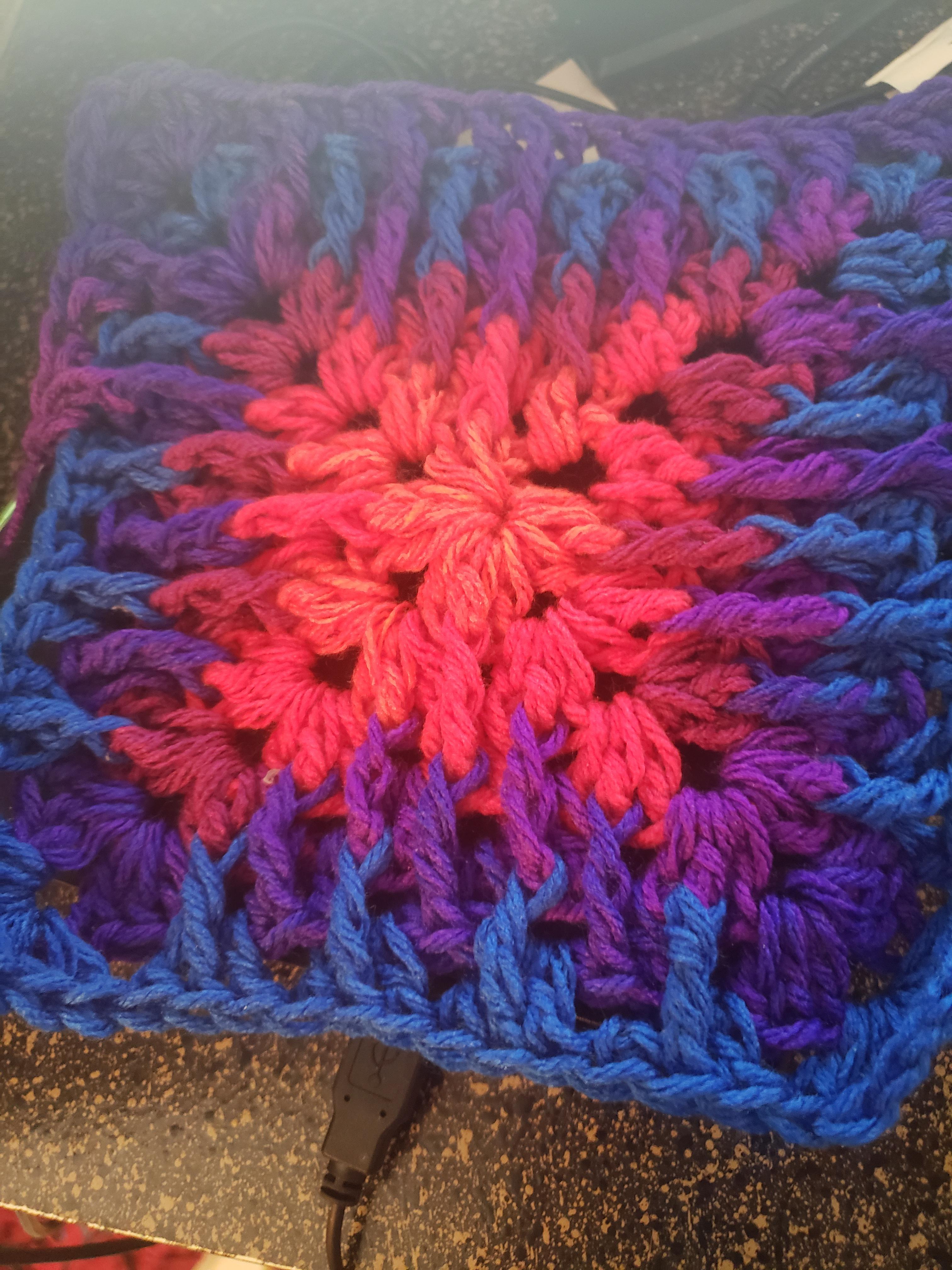 WIP Granny Square blanket with a twist. Loving the colors in this variegated yarn r/Brochet