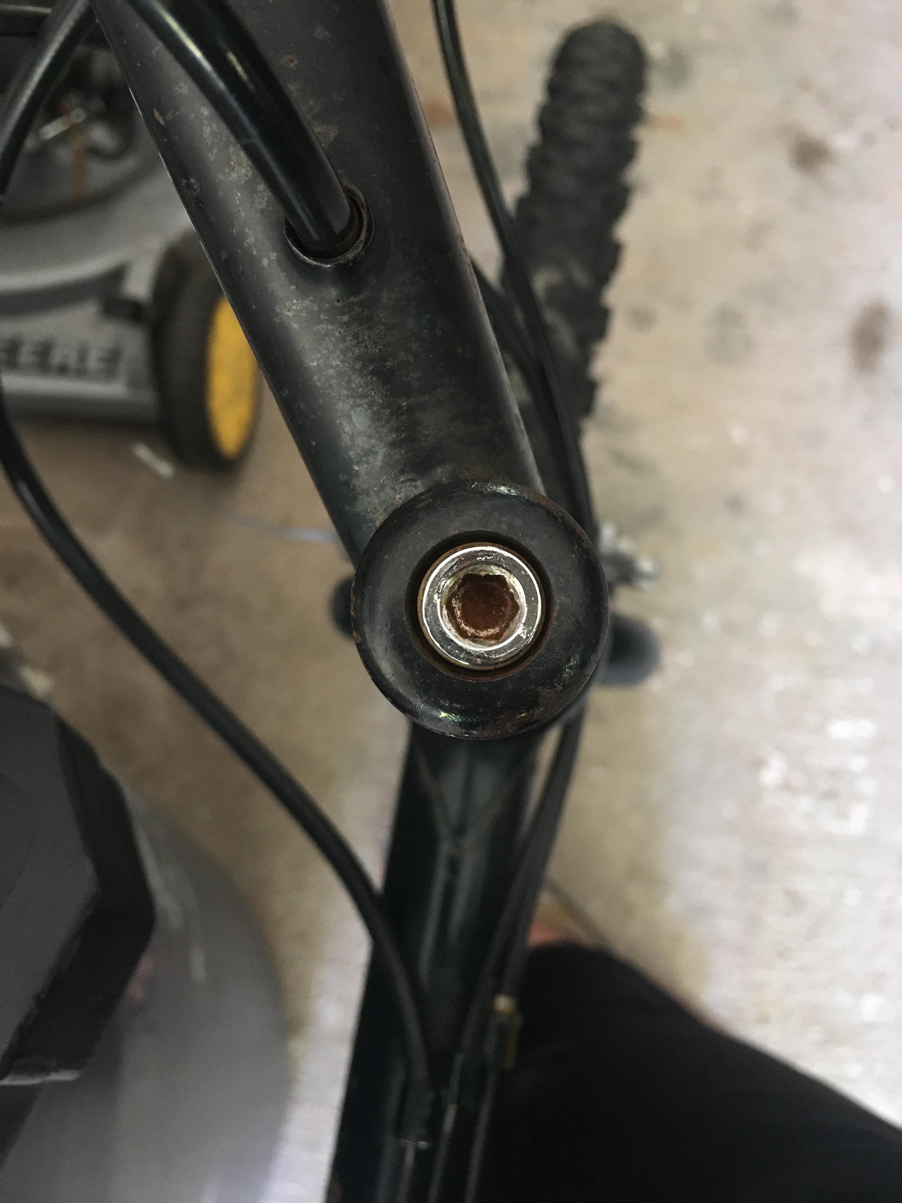 Handlebars are crooked and this bolt seems to be frozen. Any tips? r