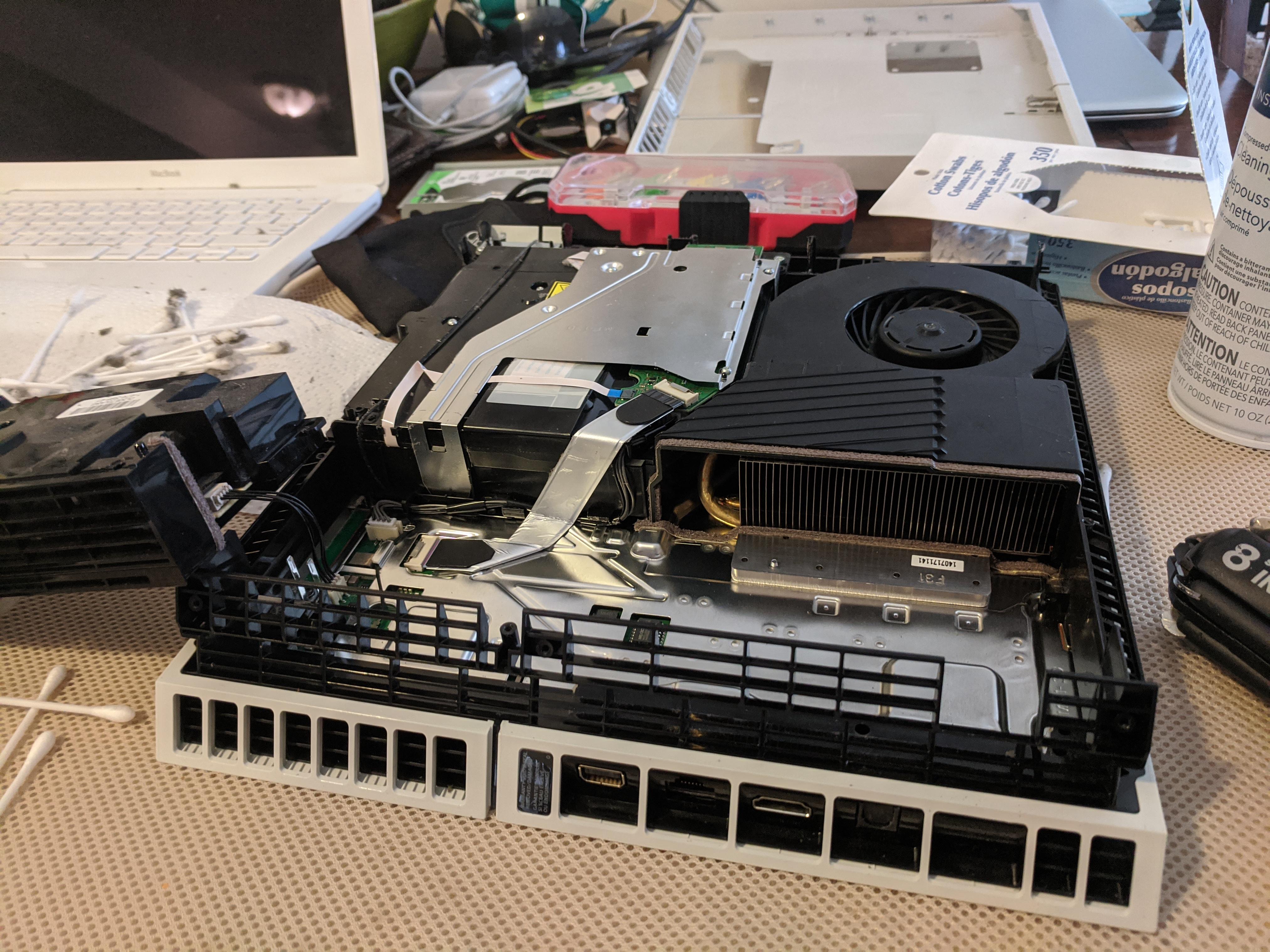 Dusting out the inside of my PS4 today...years of dust build up. r