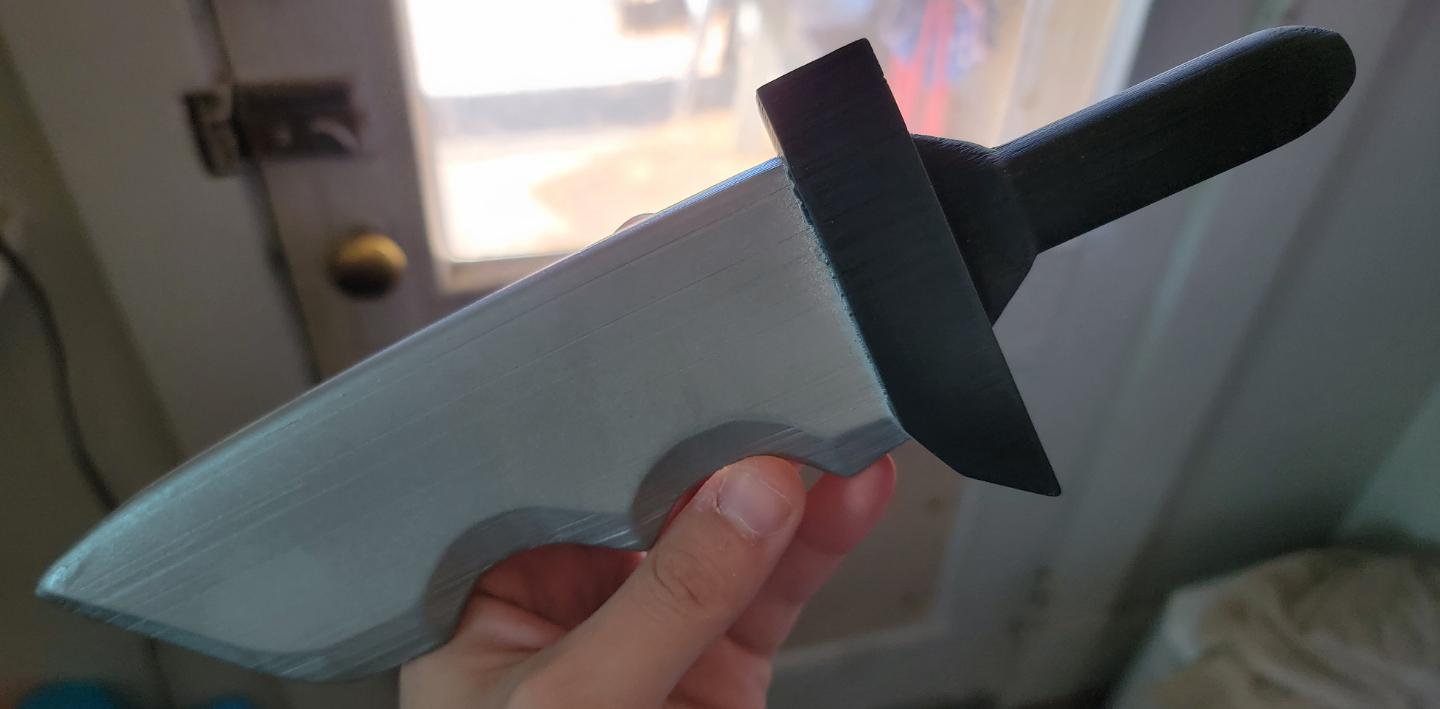 I modeled an Among Us Imposter knife in Blender and 3D printed it for a