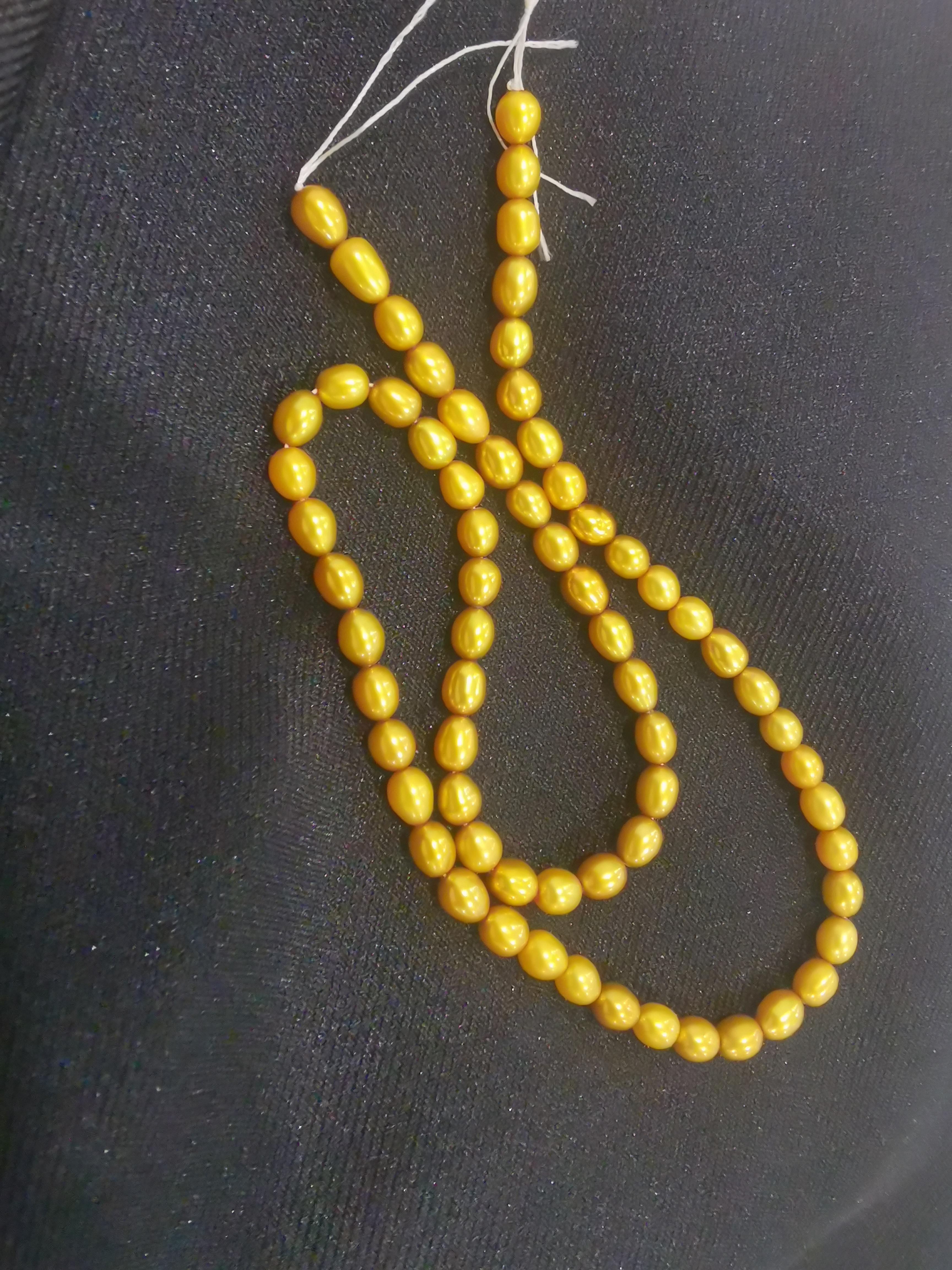 A strand of golden pearls for 2. r/ThriftStoreHauls