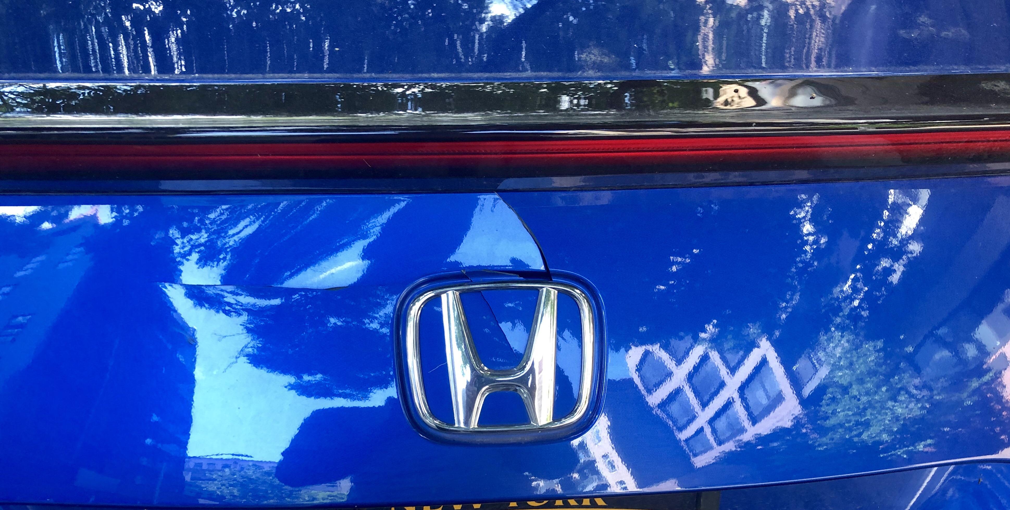 Cracked Trunk lid noticed someone/smthng hit and cracked the plastic trunk lid on my 2018 lx