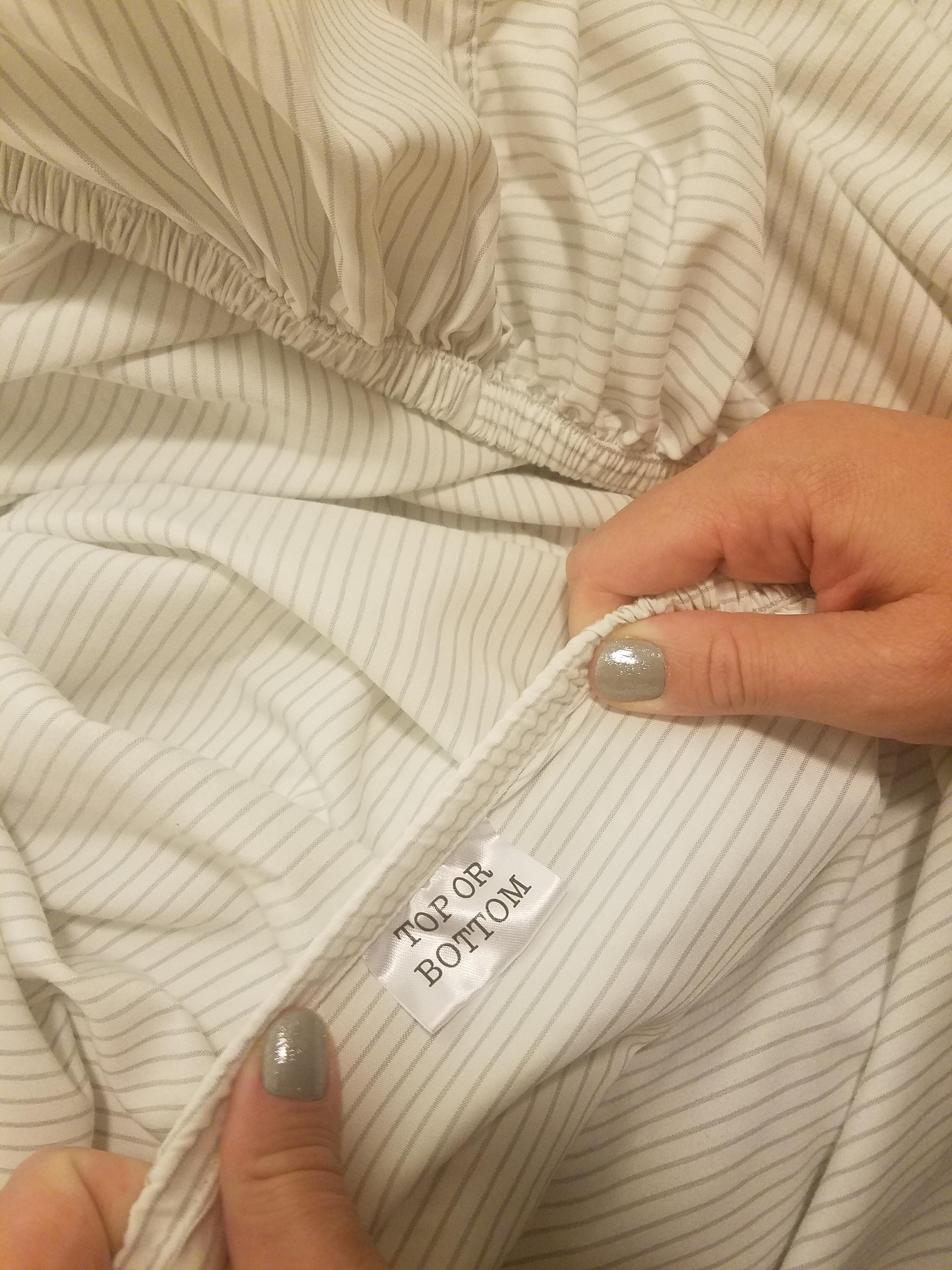 Our fitted sheets have a tag to show the orientation to place them on