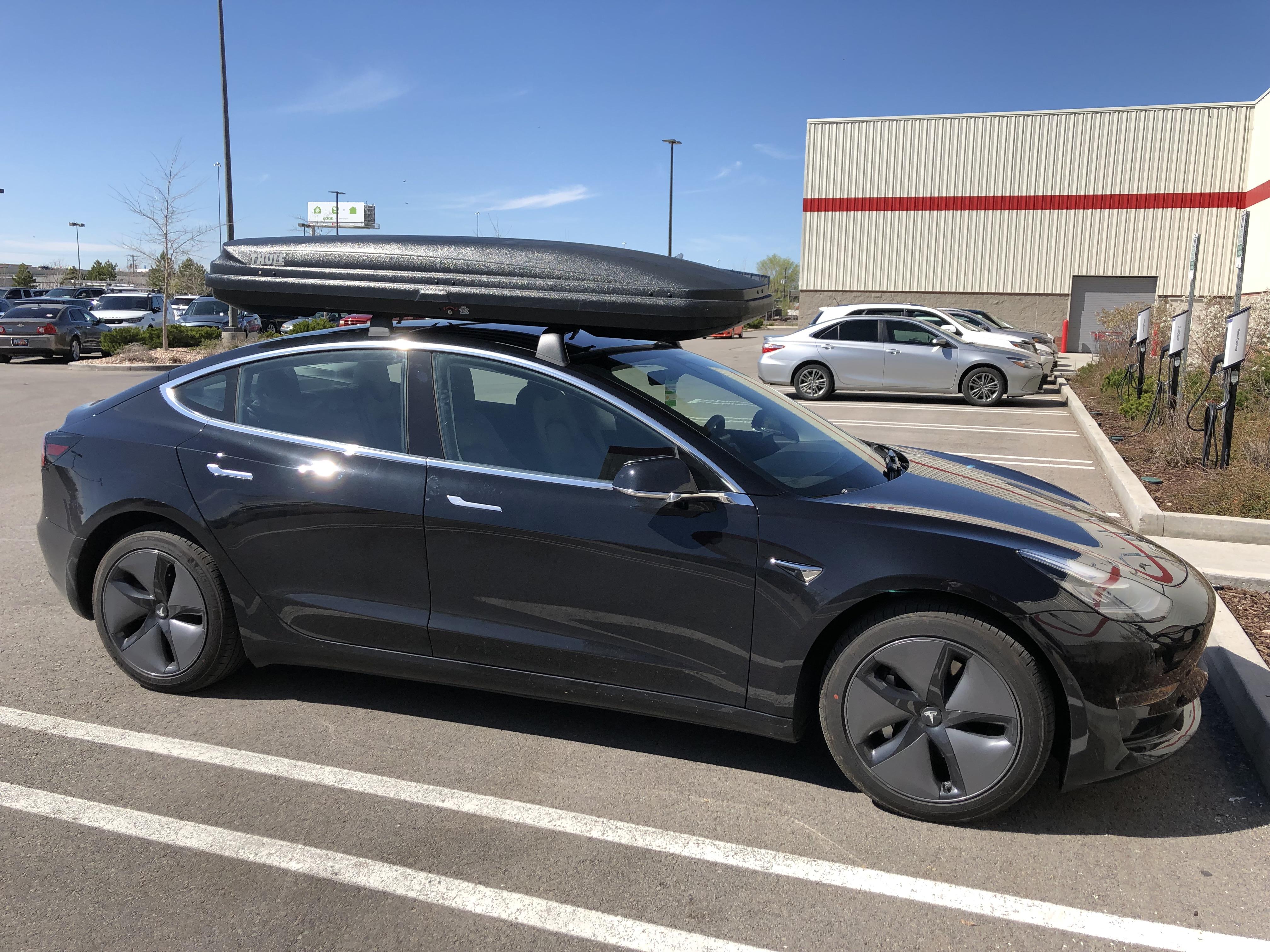 Roof Rack came today! Mounted a Thule Alpine box as well. r/teslamotors