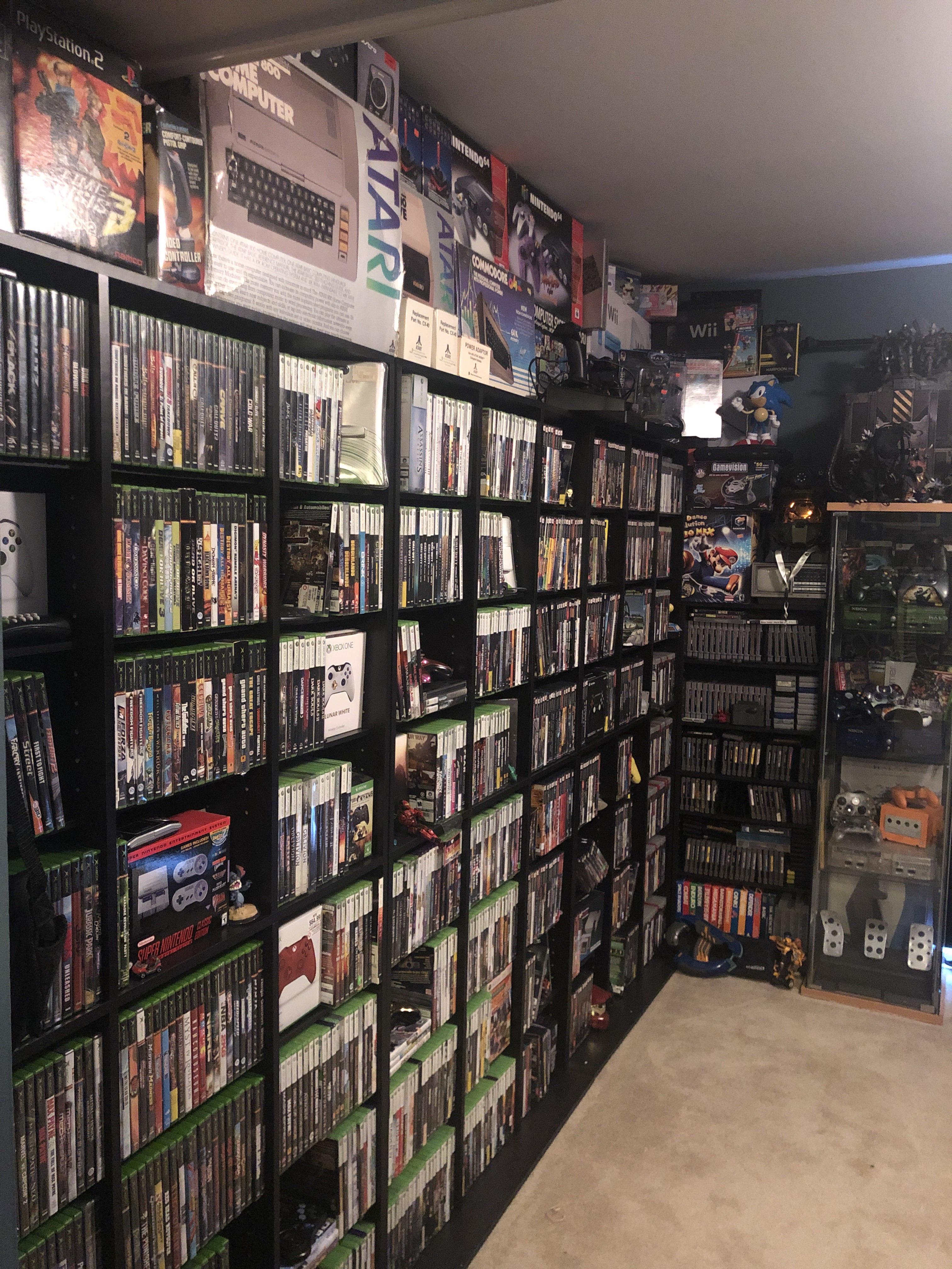 1 wall of my game room. Anyone want to see the other? r/gamecollecting