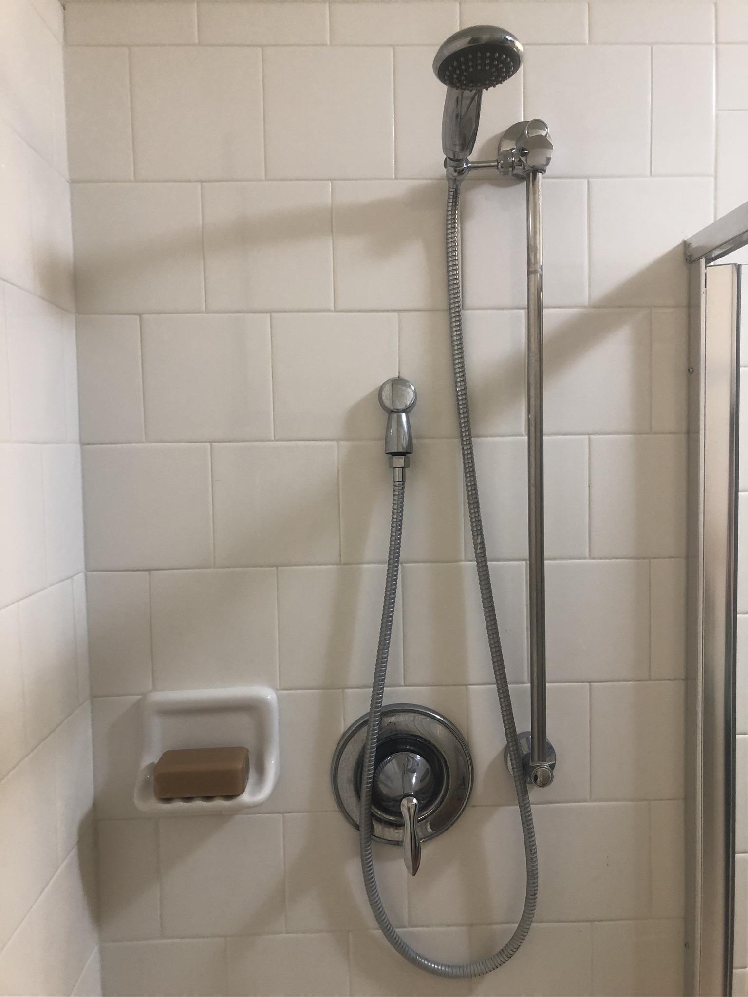 Live in a rental, and even at the top, the shower head is too short for