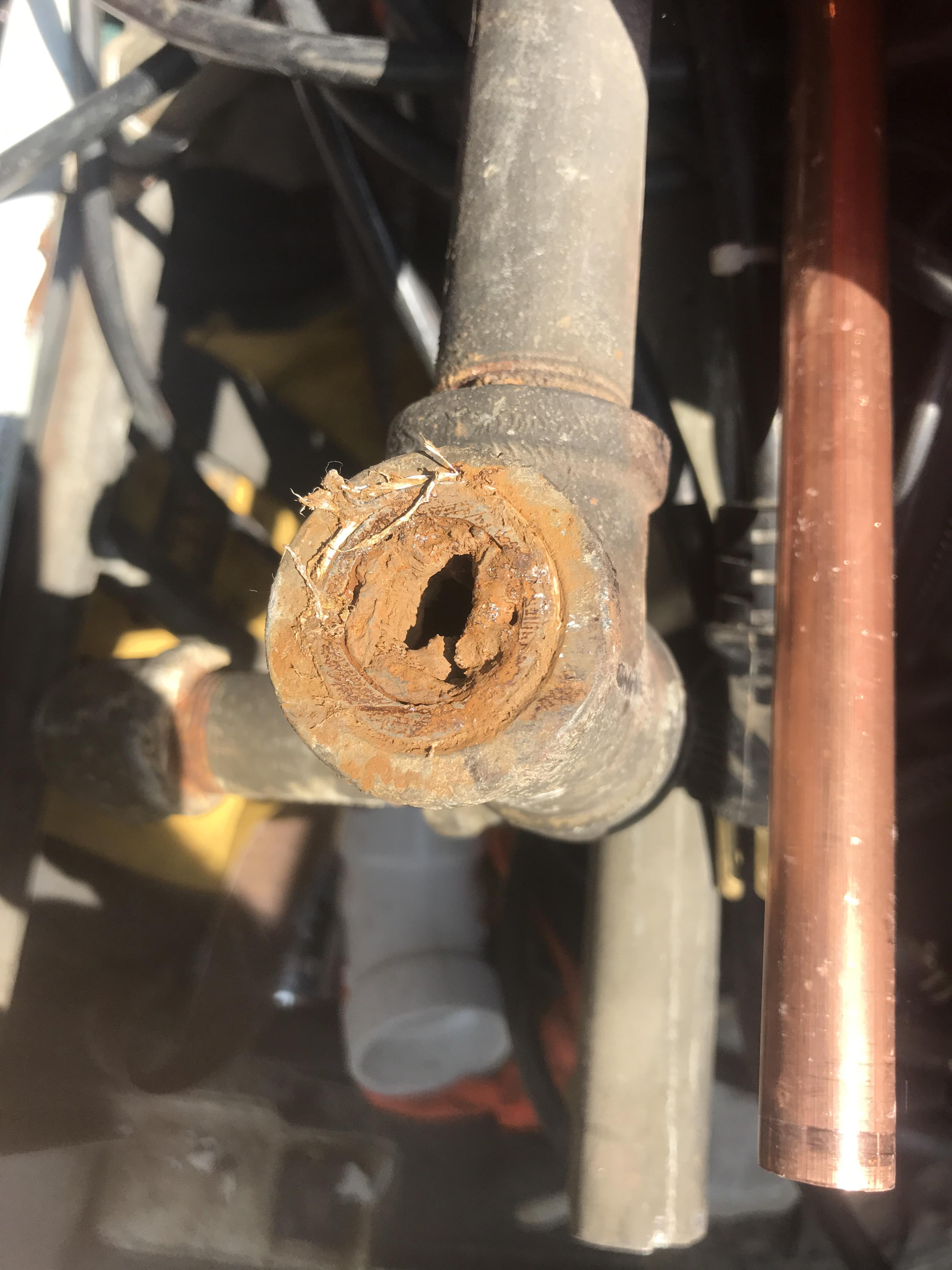 The inside of a 60 year old water line. Yum r/Plumbing