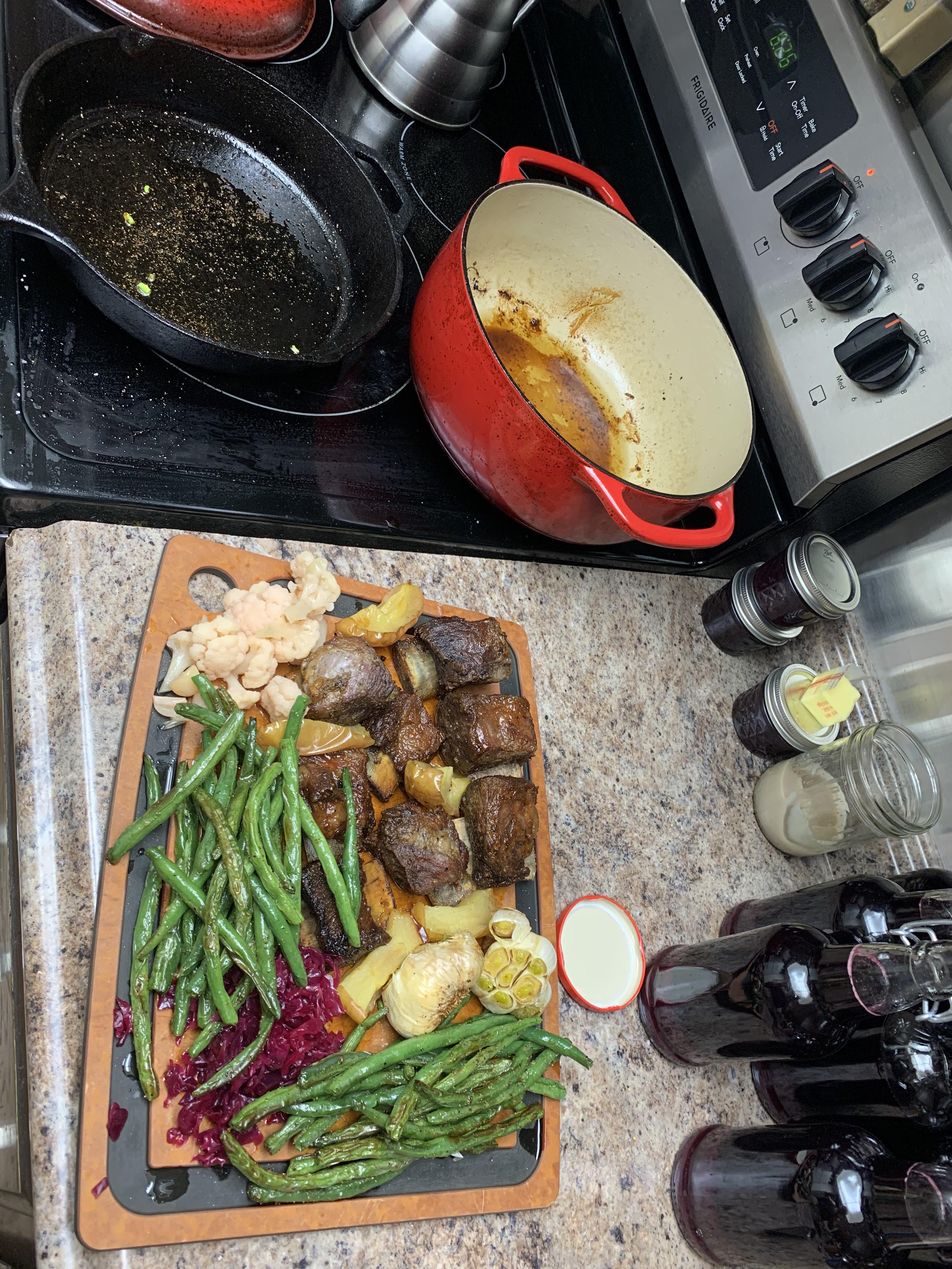 Shortribs, apples and garlic in dutch oven, greenbeans in skillet. I