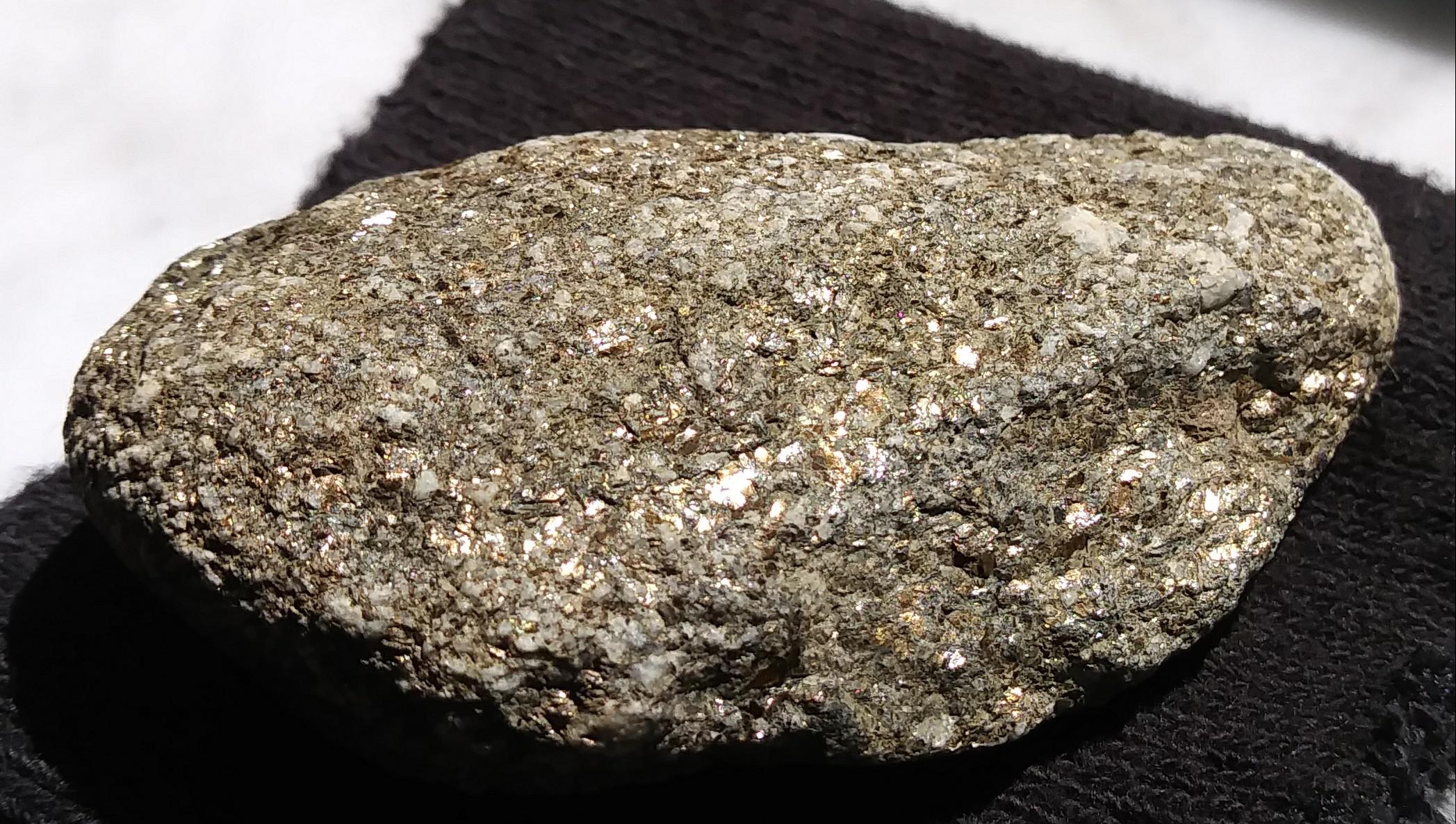 Gold flake imbedded rock found in Blue River, Colorado. Home tested