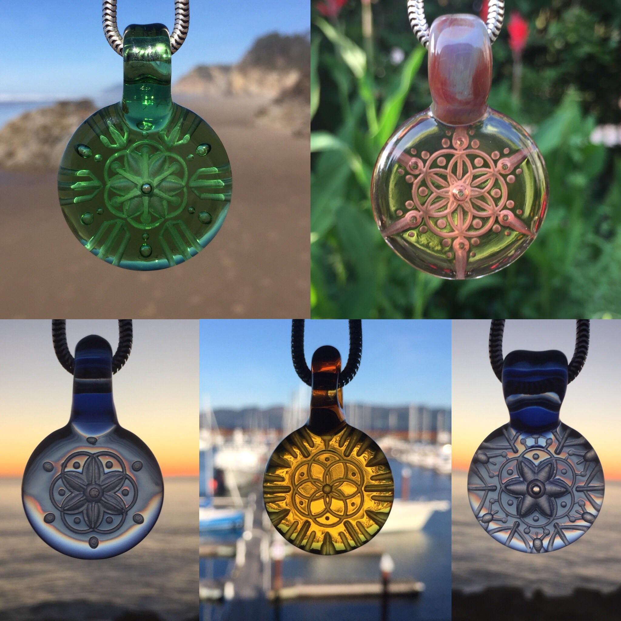 Some glass pendants I made this year r/handmade