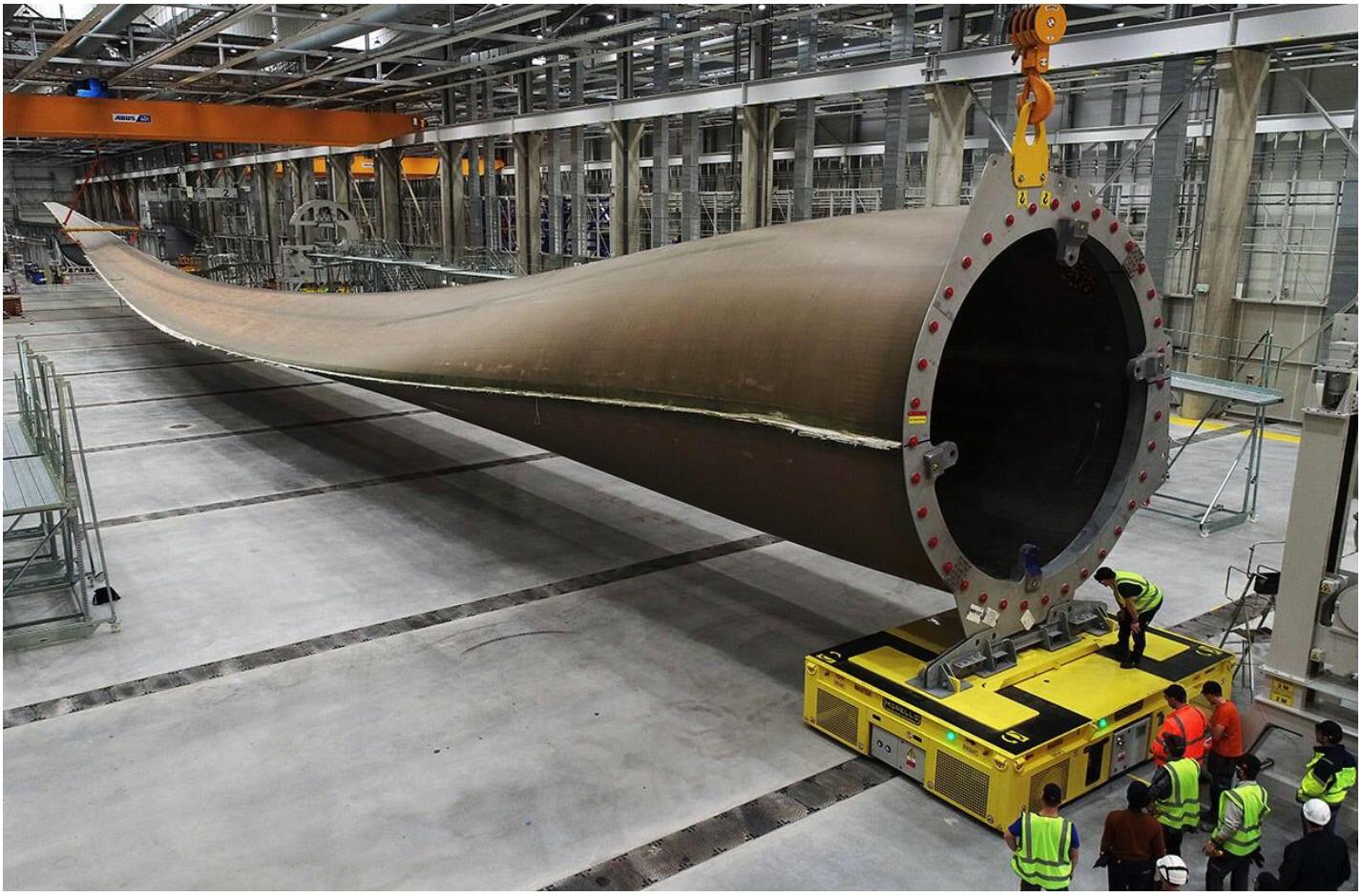 107m (351ft) wind turbine blade for a 12MW GE offshore turbine. Person