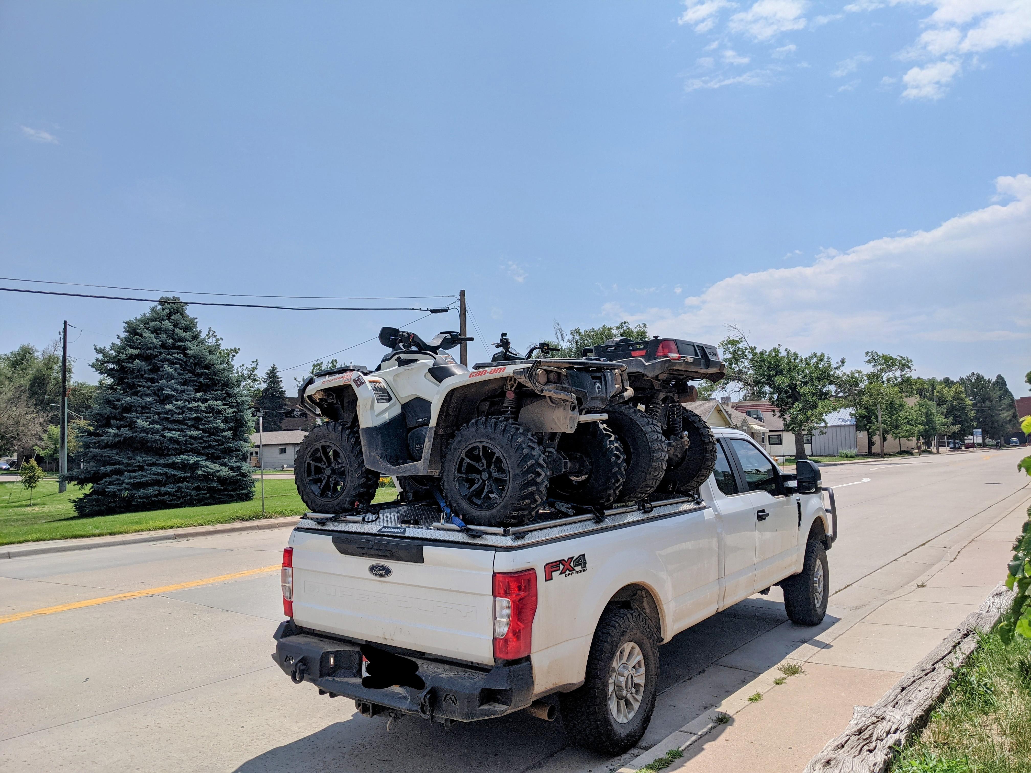 Kids loaded in the truck bed, about to head to Taos for the weekend 🔥