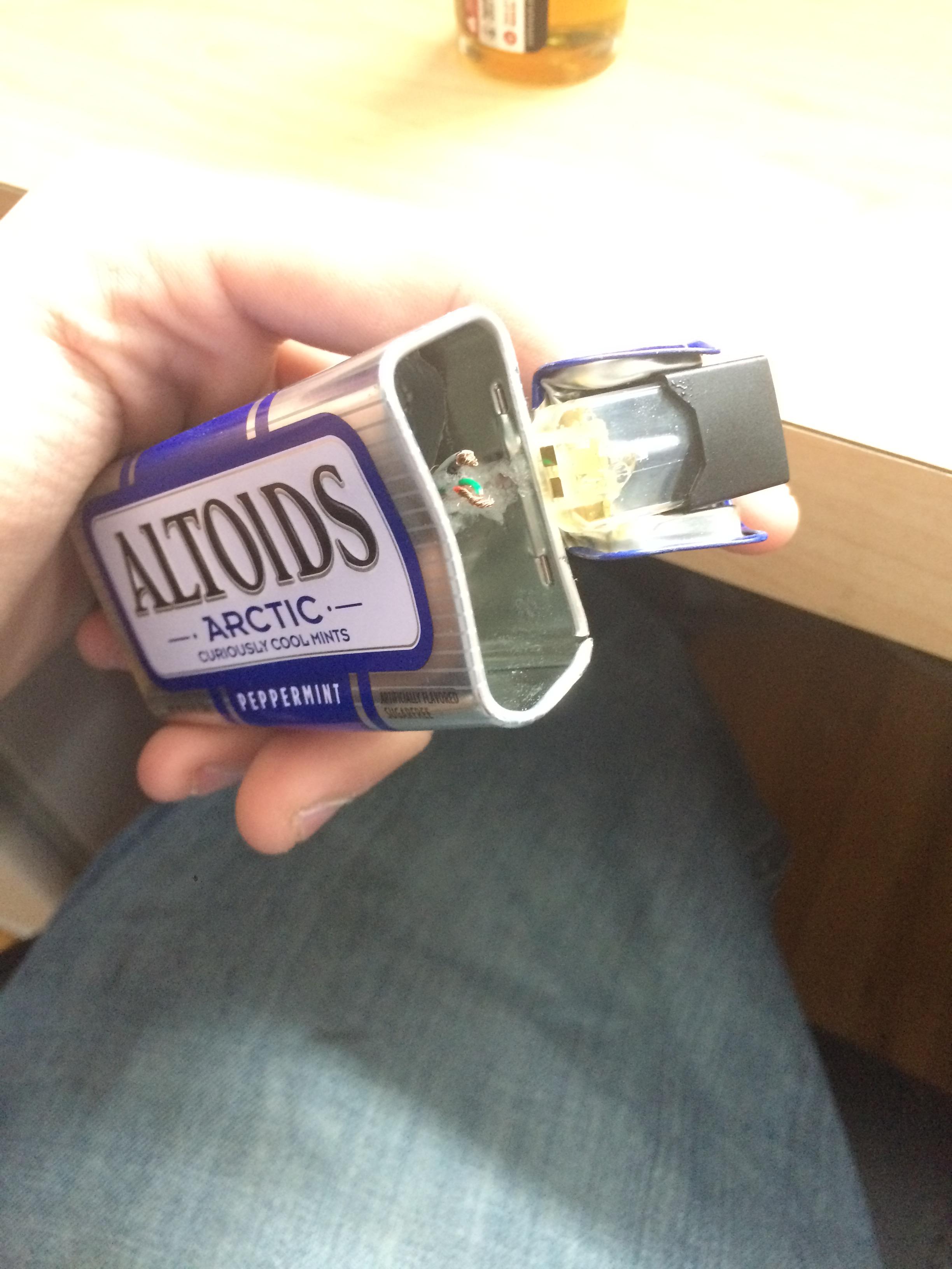 My ghetto rigged Used juul pod hooked up to a phone charge in an