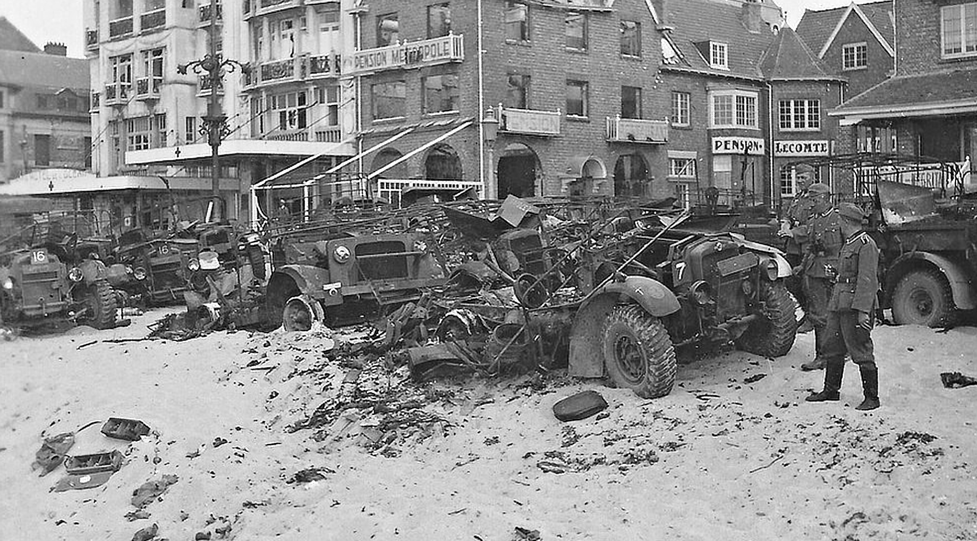 Wrecked British army vehicles on the outskirts of Dunkirk beach, Set on