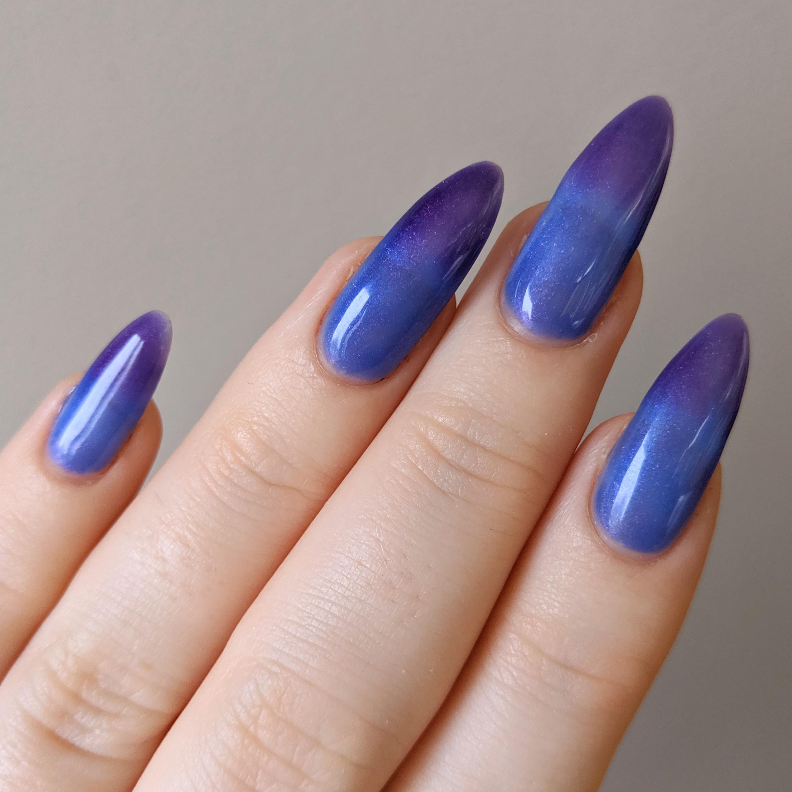 Thermochromic nails! Purple when cold, blue when warm. My nail girl got
