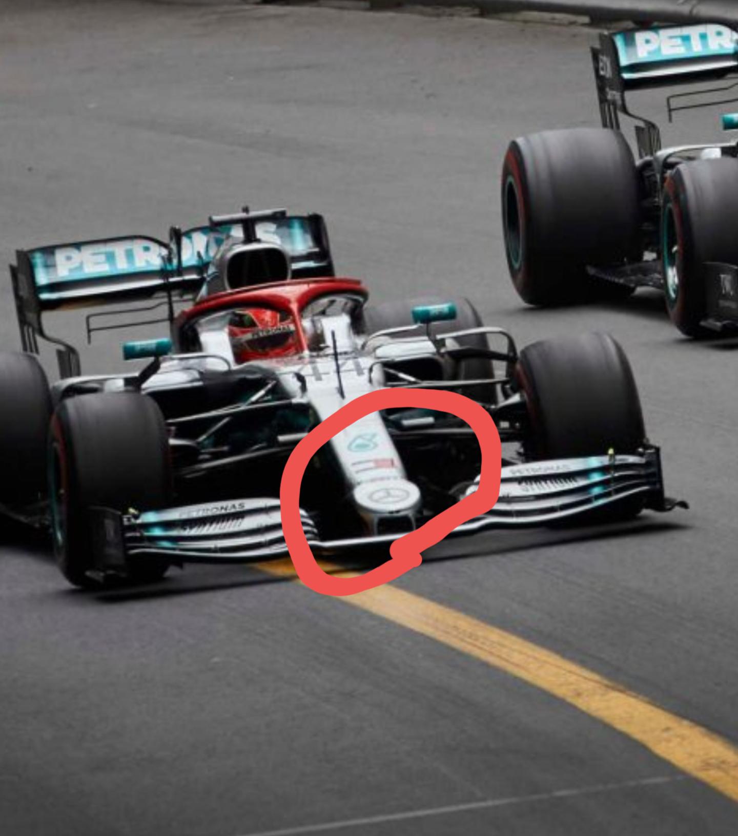Can someone explain me why mercedes has a circle at tge front of the