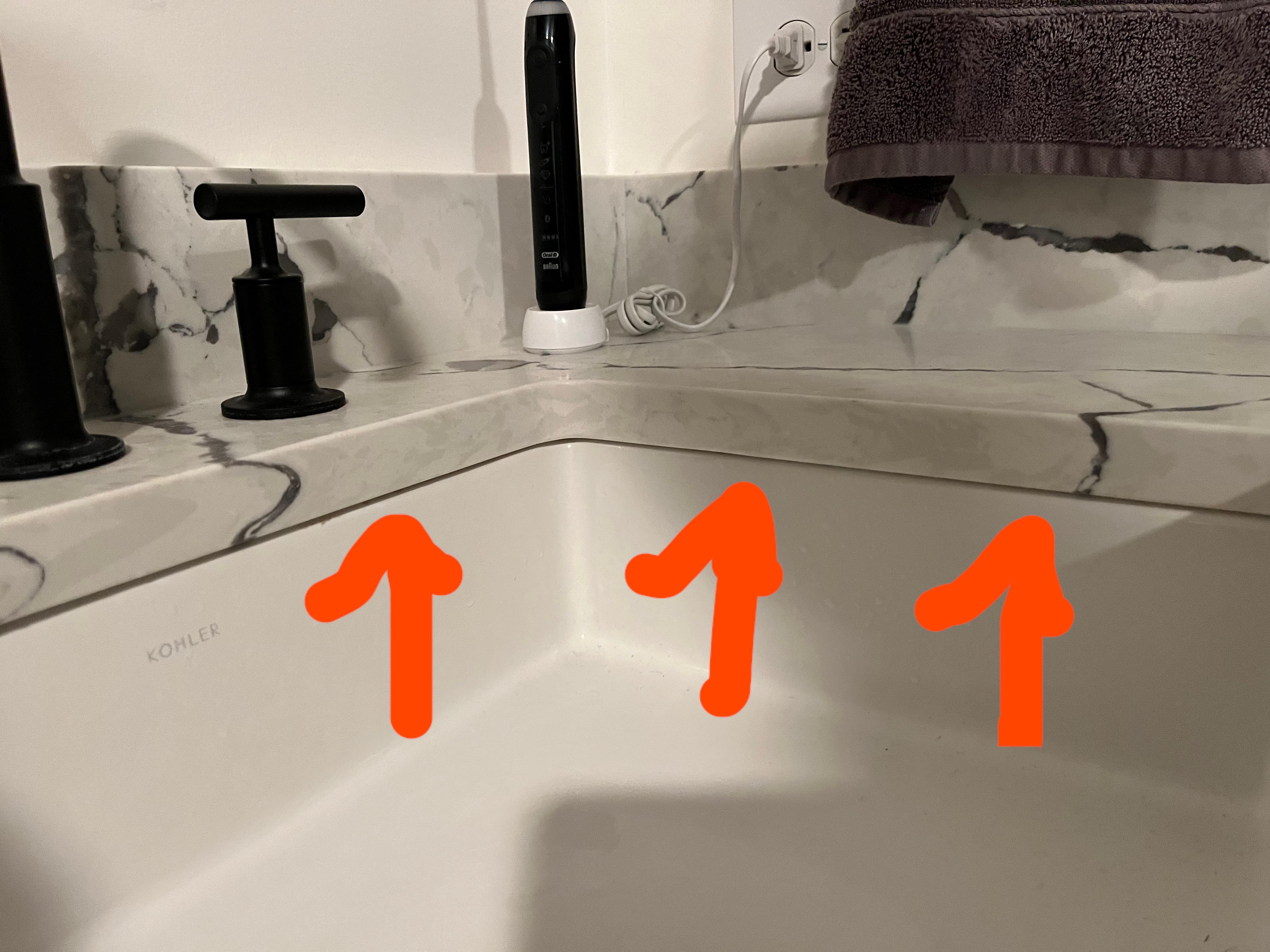 Should the small gap between the sink and the counter be caulked? r