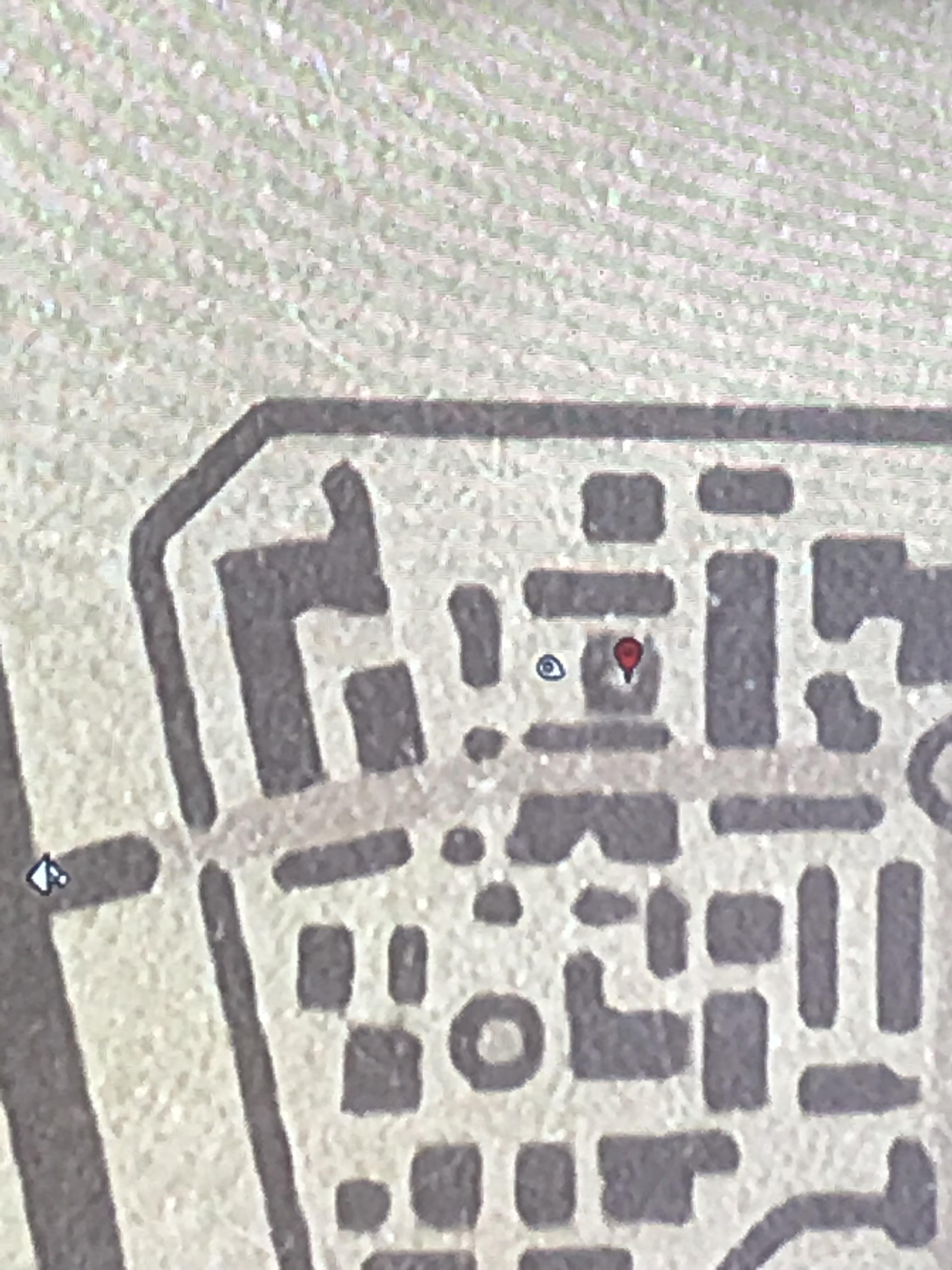 Absinthe bottle in Saint Denis graveyard. Inside crypt where marker is