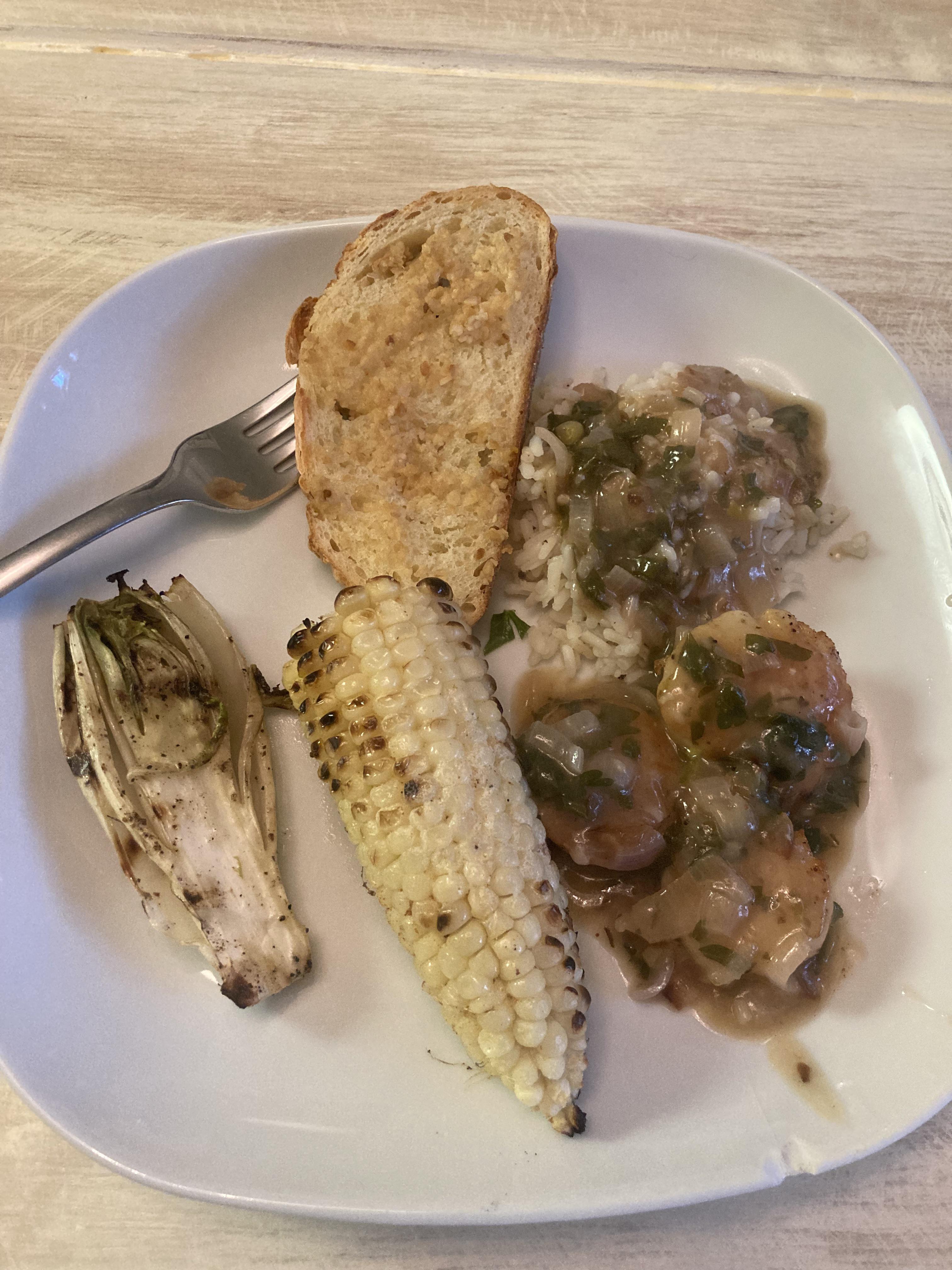 Seared sea scallops in white wine lemon butter sauce. With white rice