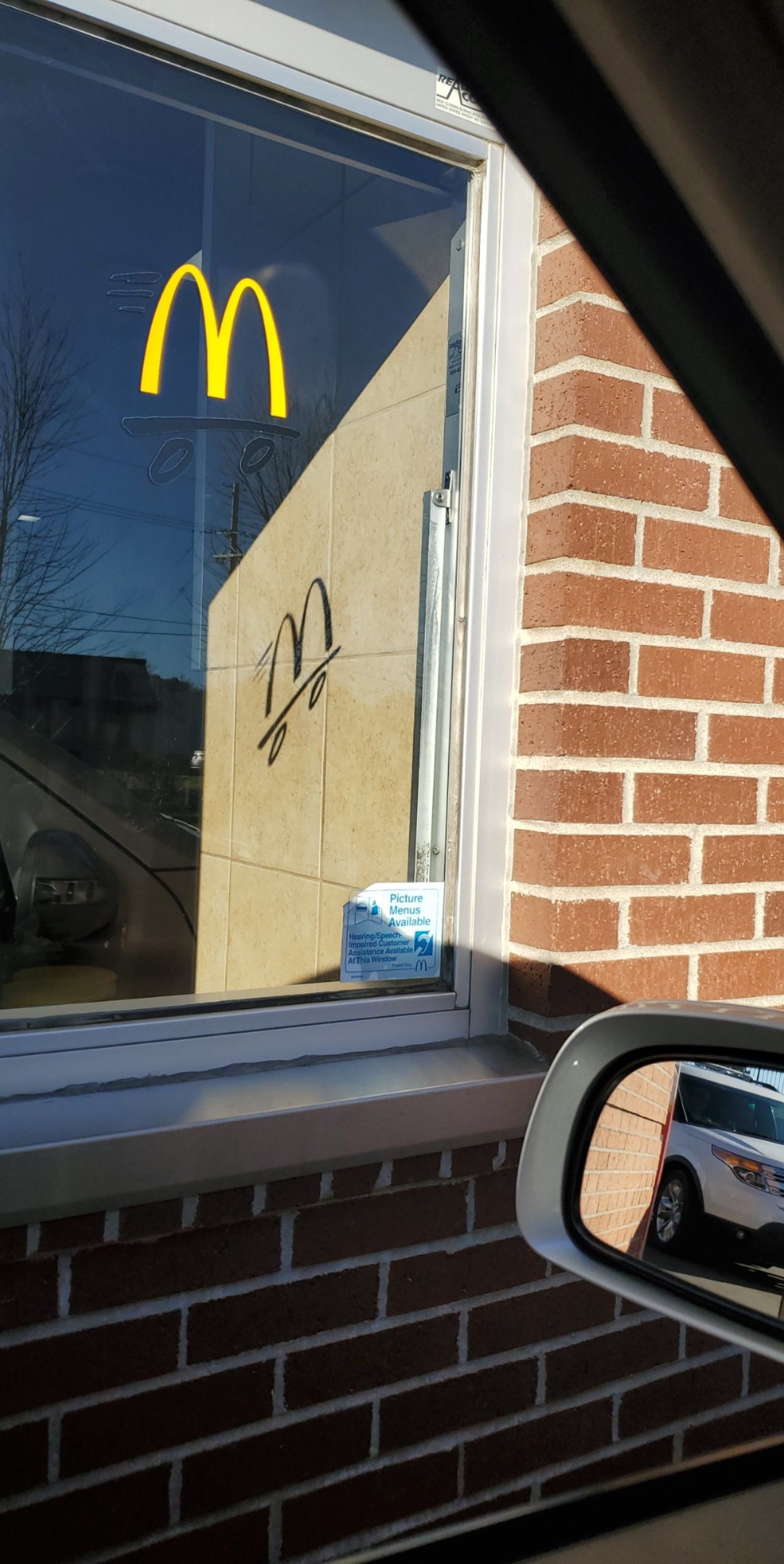 The shadow of this McDonald's drive thru window r/mildlyinteresting
