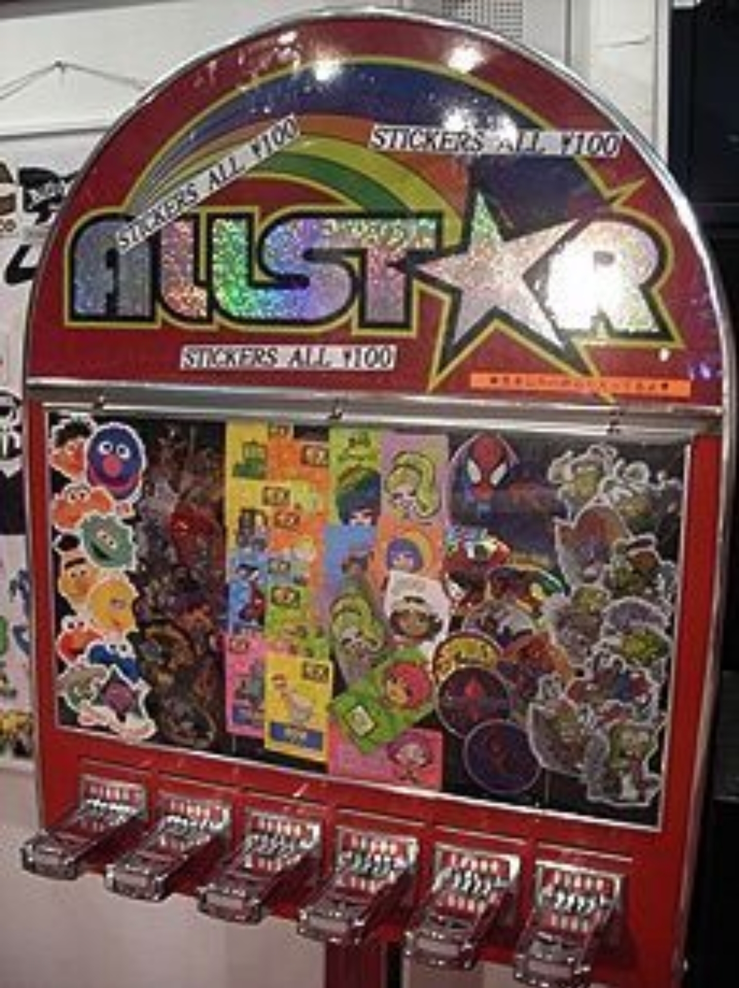 Vending Machines with shiny stickers that came out with a piece of