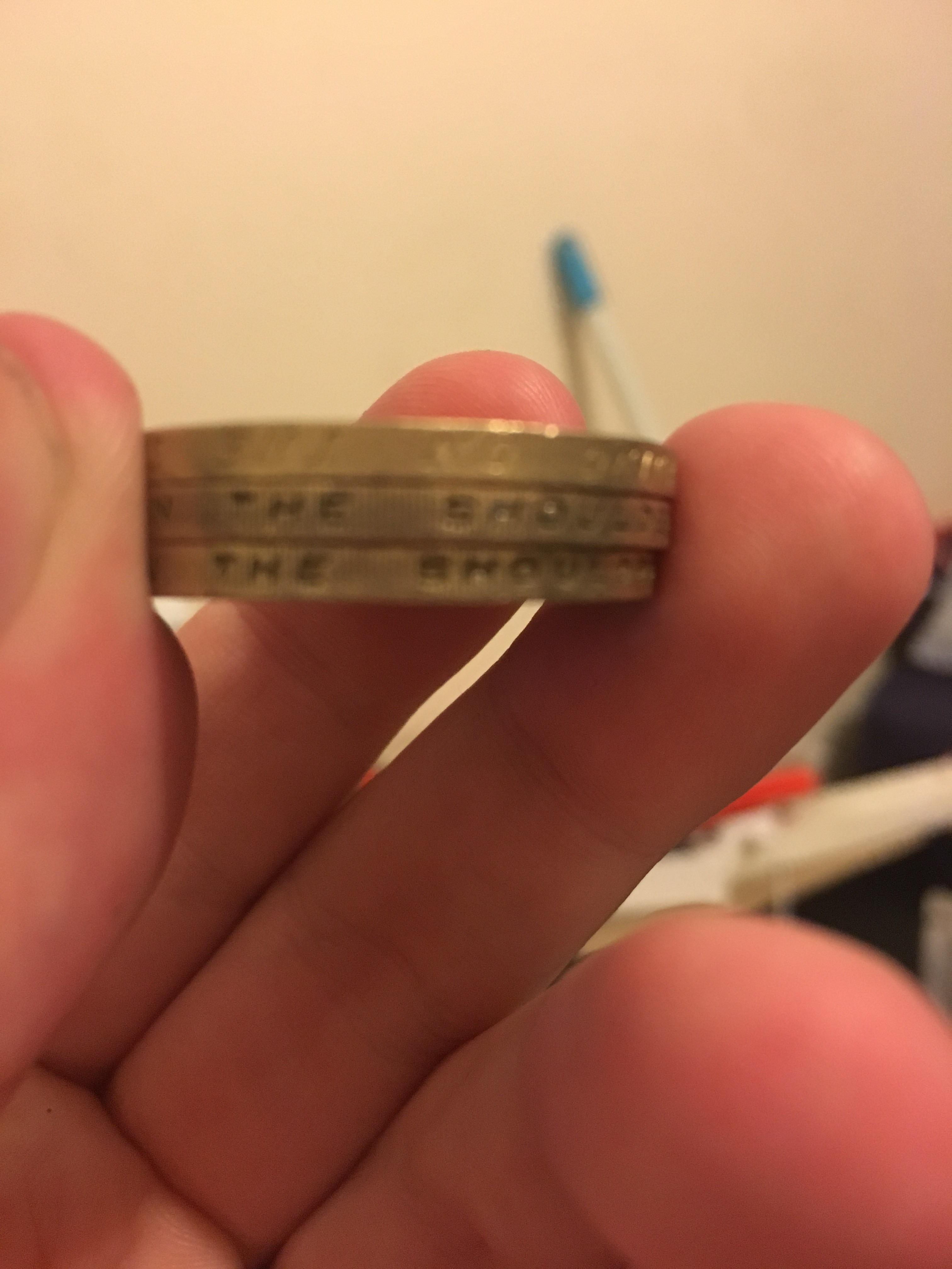 The writing on the top coin is upside can’t see it well in photo, worth