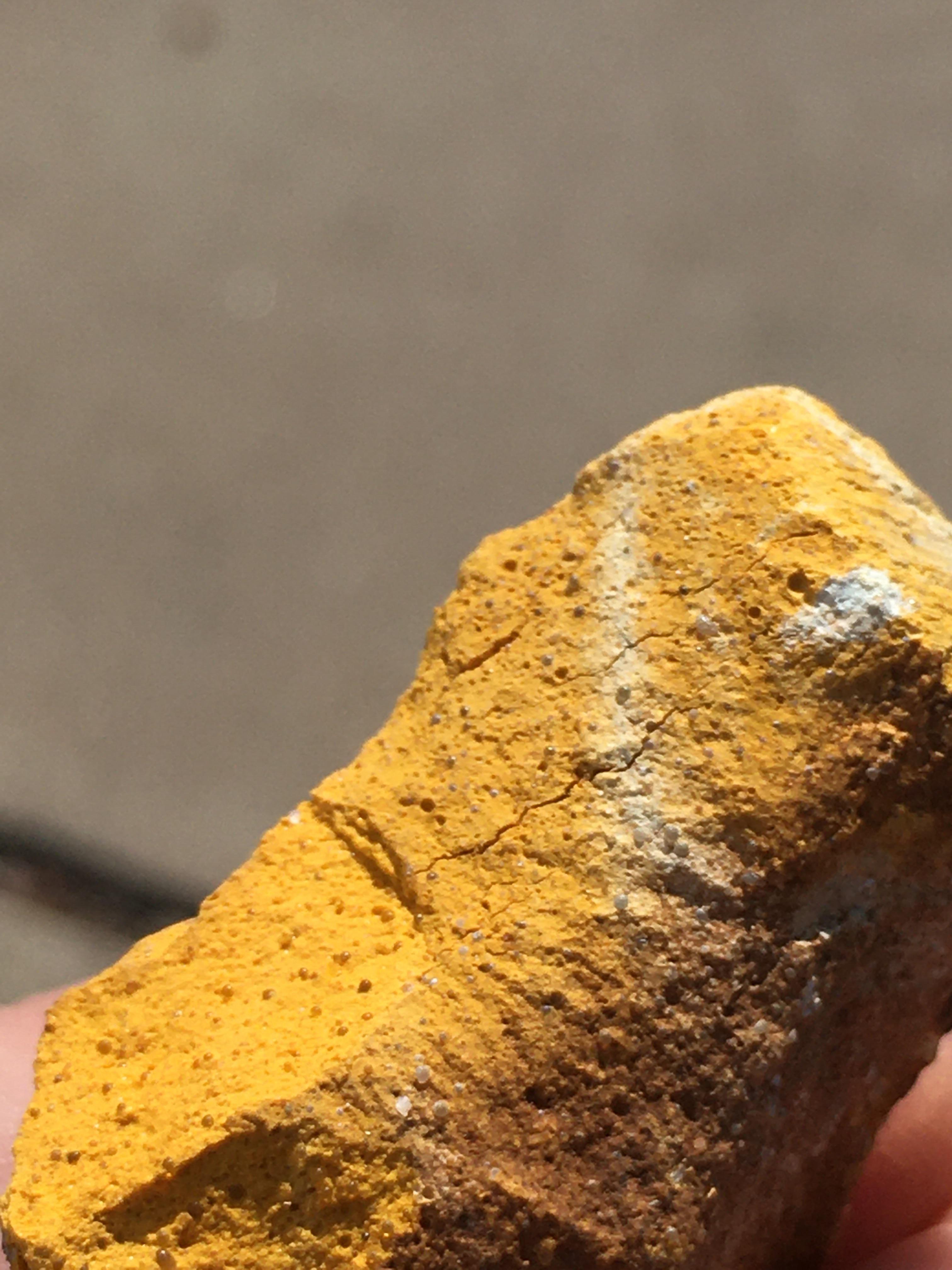 Porous yellow rock that can be used as chalk r/whatsthisrock