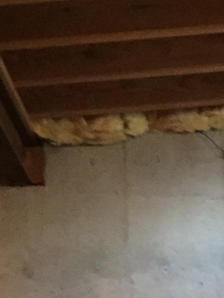 I have exposed fiberglass insulation in my basement where I work out. What should I do about