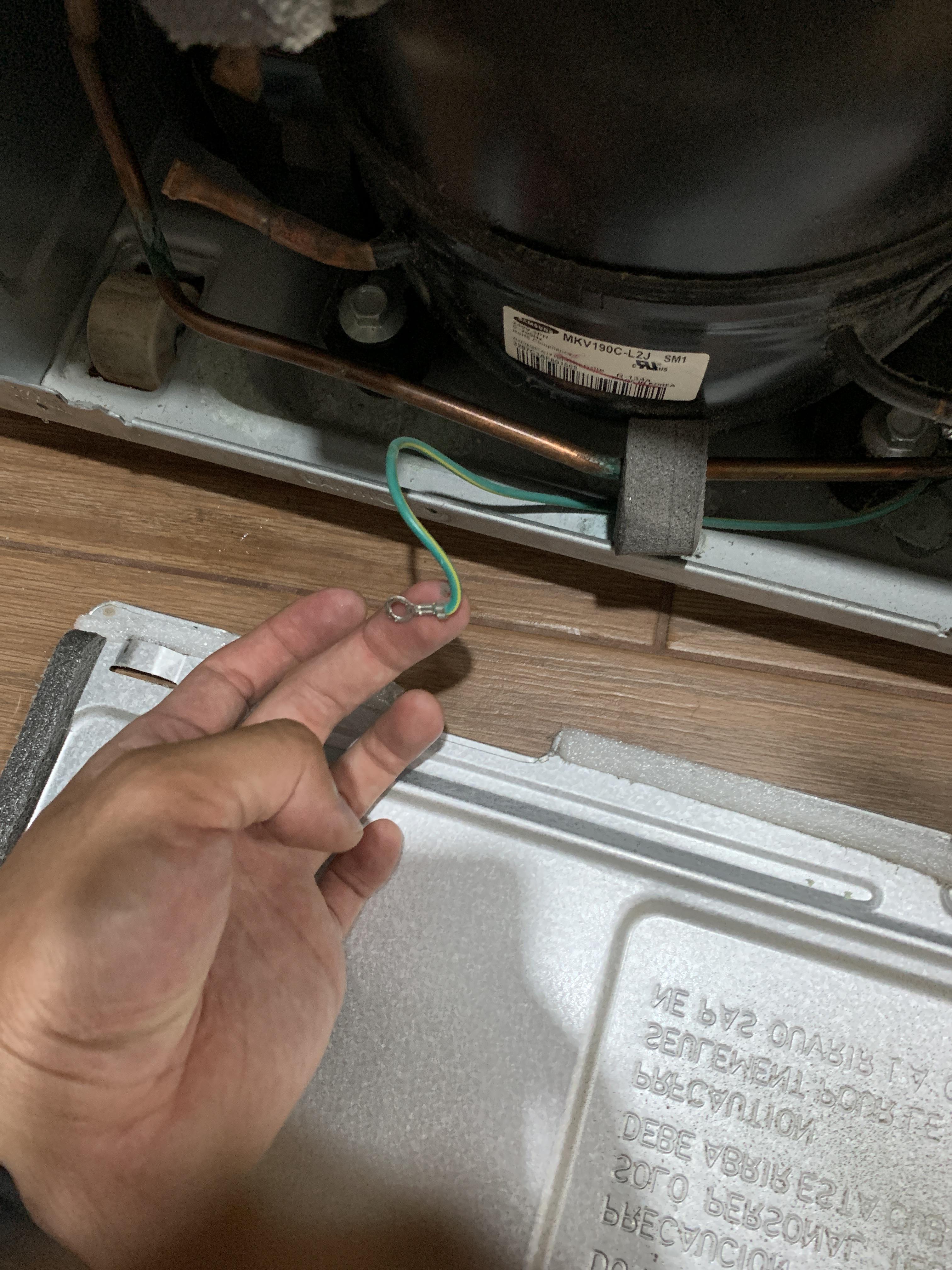 Cleaning Samsung refrigerator condenser coils and noticed this by condenser, what should it be