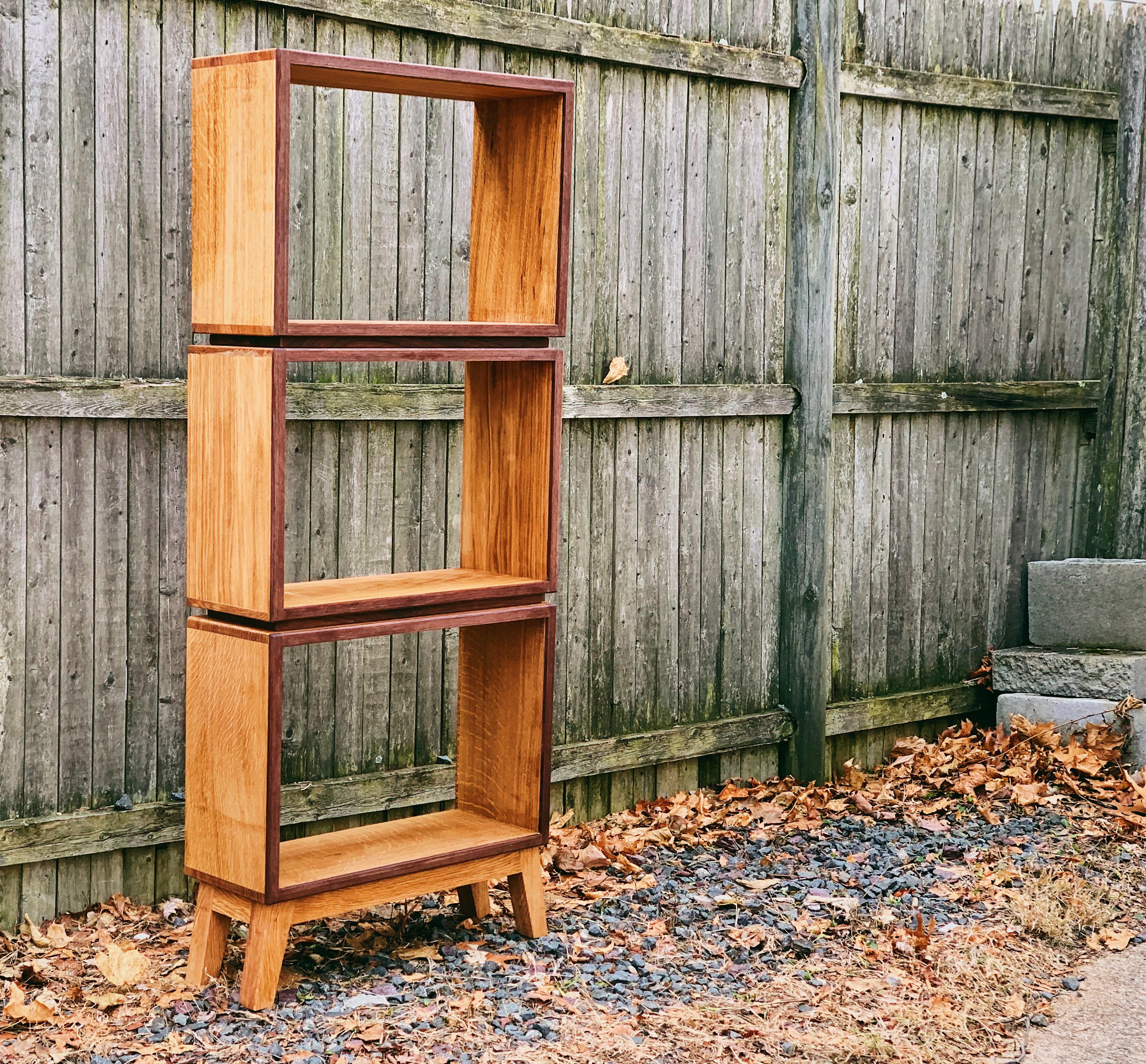 “Floating” bookcase quarter sawn white oak with walnut accents. r