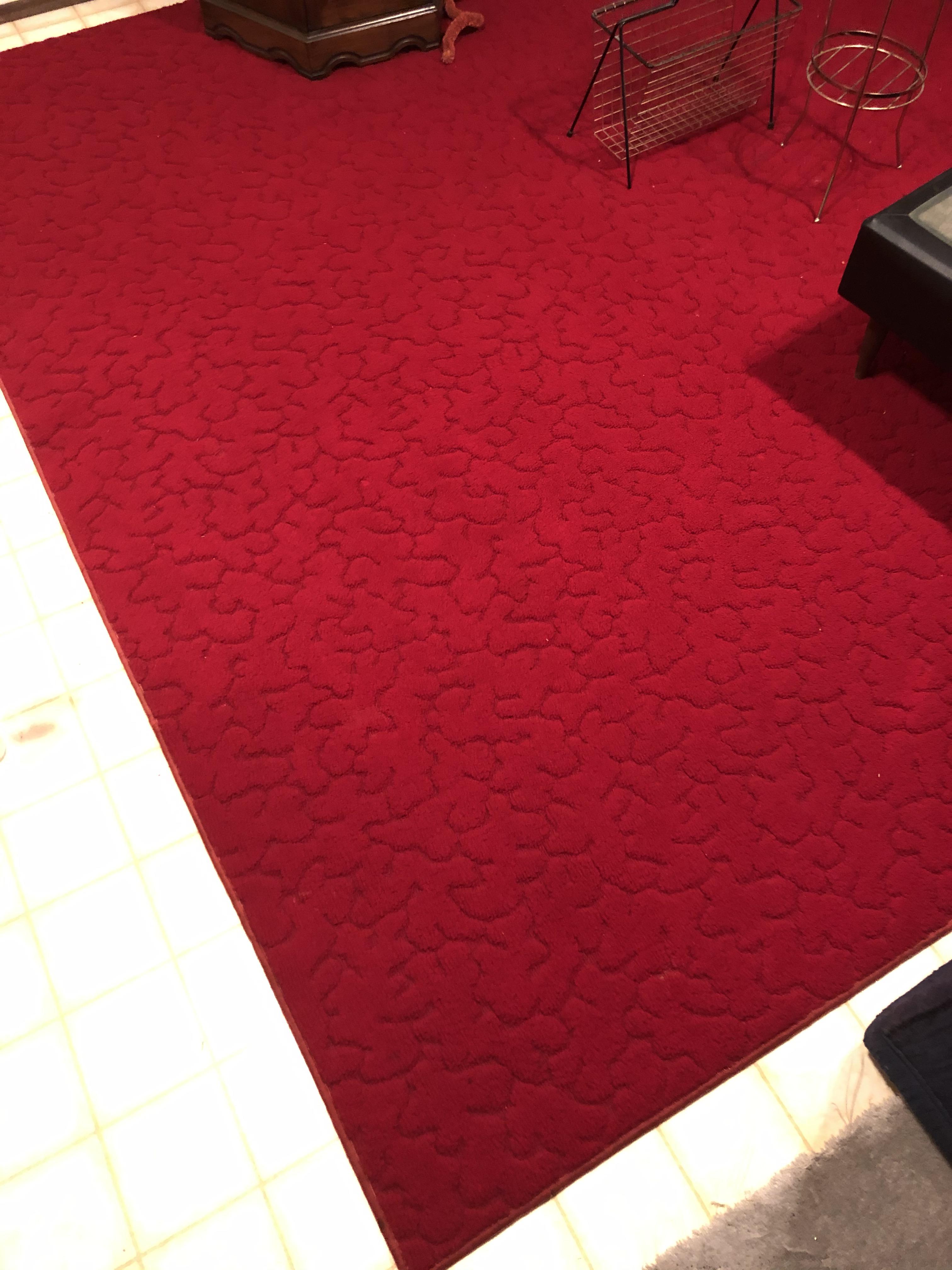 Can you help me identify this area rug and put a value to it? Purchased